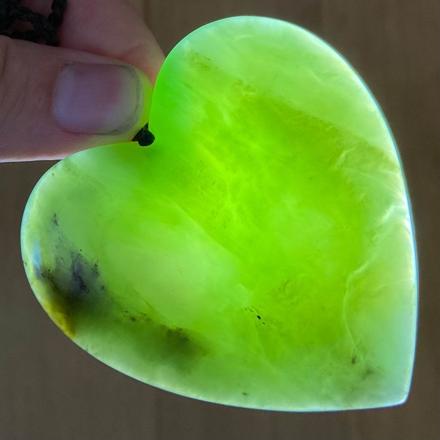 Heart pendant hand-carved from New Zealand kawawkawa pounamu (greenstone). Translucency.