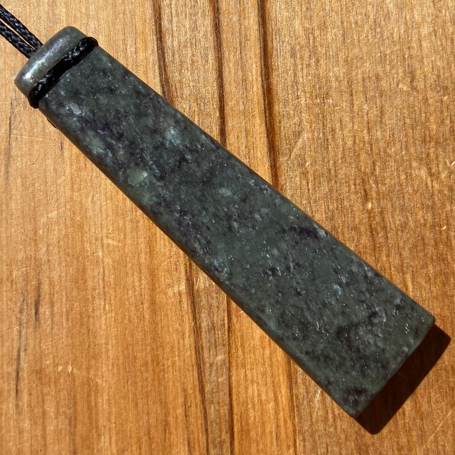 Pounamu toki from New Zealand Totoweka pounamu (greenstone). Back.