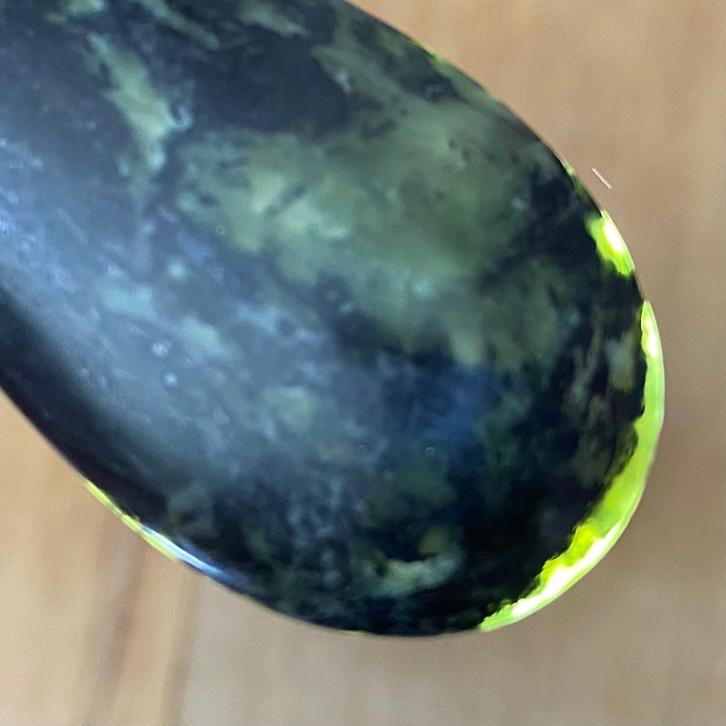 Bound roimata (teardrop) pendant hand-carved from New Zealand Douglas Creek pounamu (greenstone). Translucency.