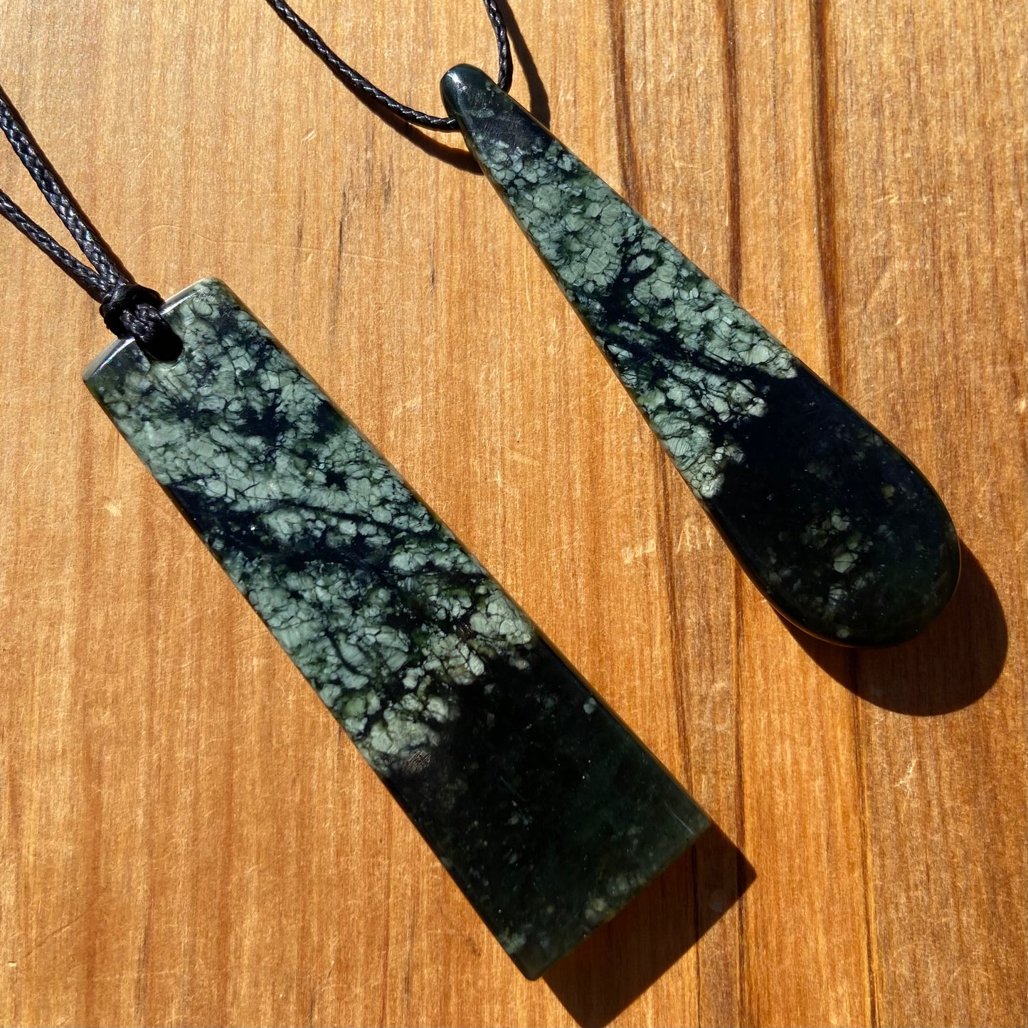 Toki and roimata pendant set hand-carved from New Zealand tangiwai pounamu. Back.