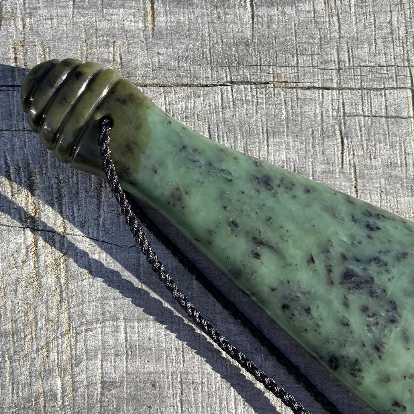 Pounamu mere hand-carved from South Westland Inanga pounamu (greenstone). Handle.