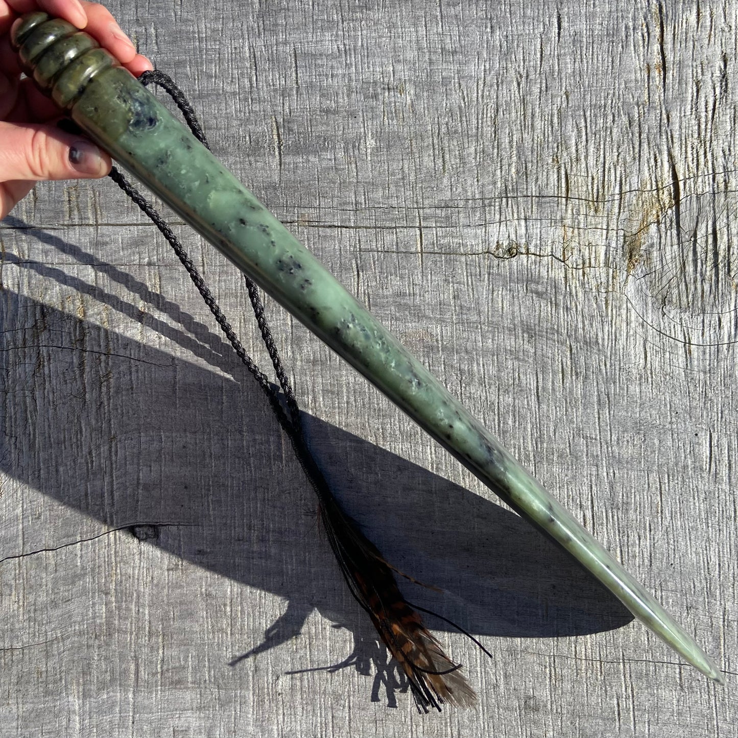 Pounamu mere hand-carved from South Westland Inanga pounamu (greenstone). Edge.