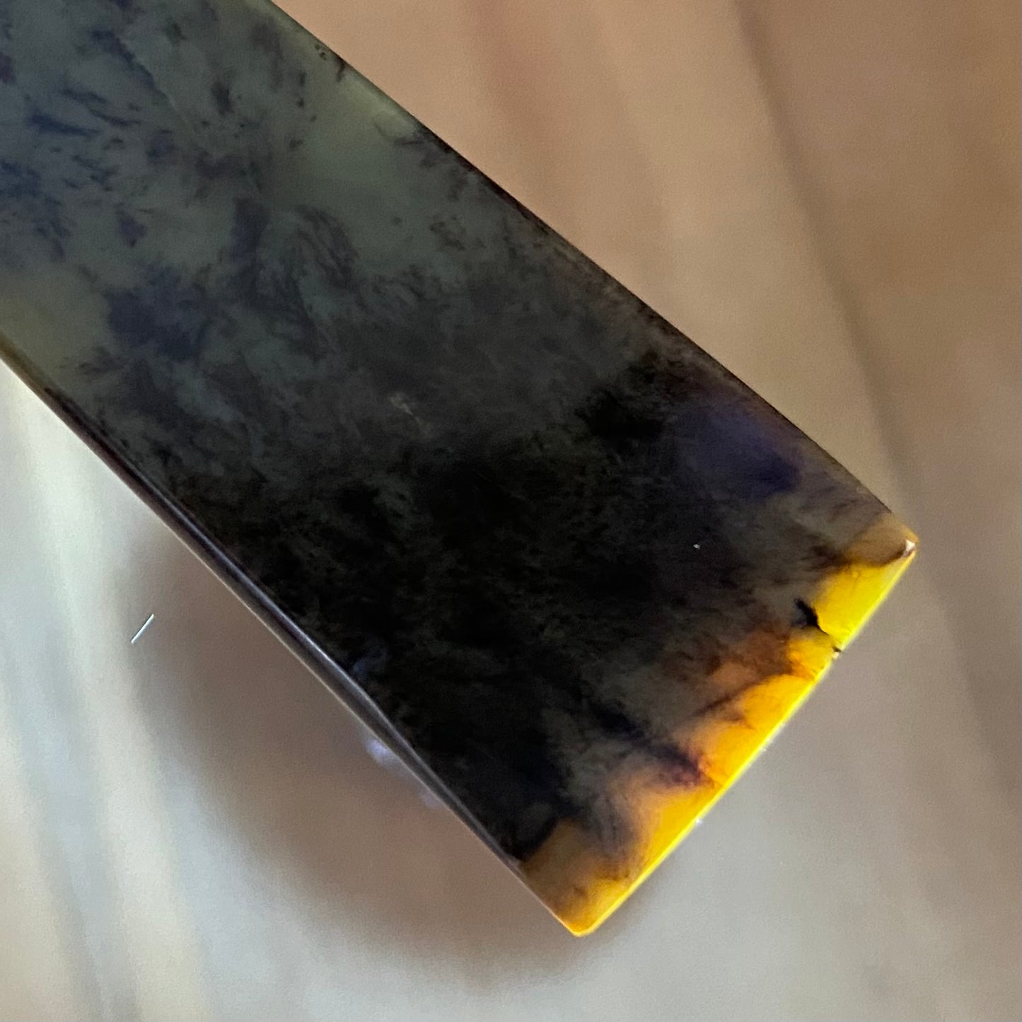 Toki pendant hand-carved from New Zealand kokopu pounamu (greenstone). Translucency.