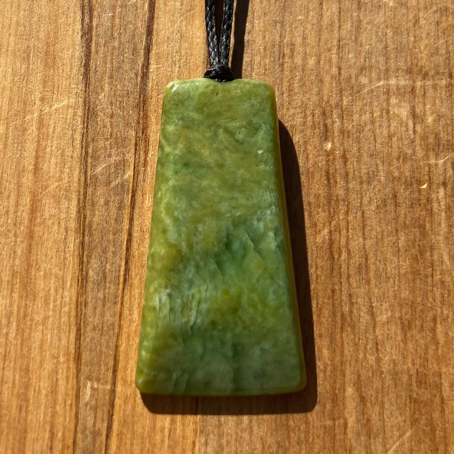 Pounamu toki pendant hand-carved from New Zealand Marsden Flower Jade pounamu (greenstone). Front