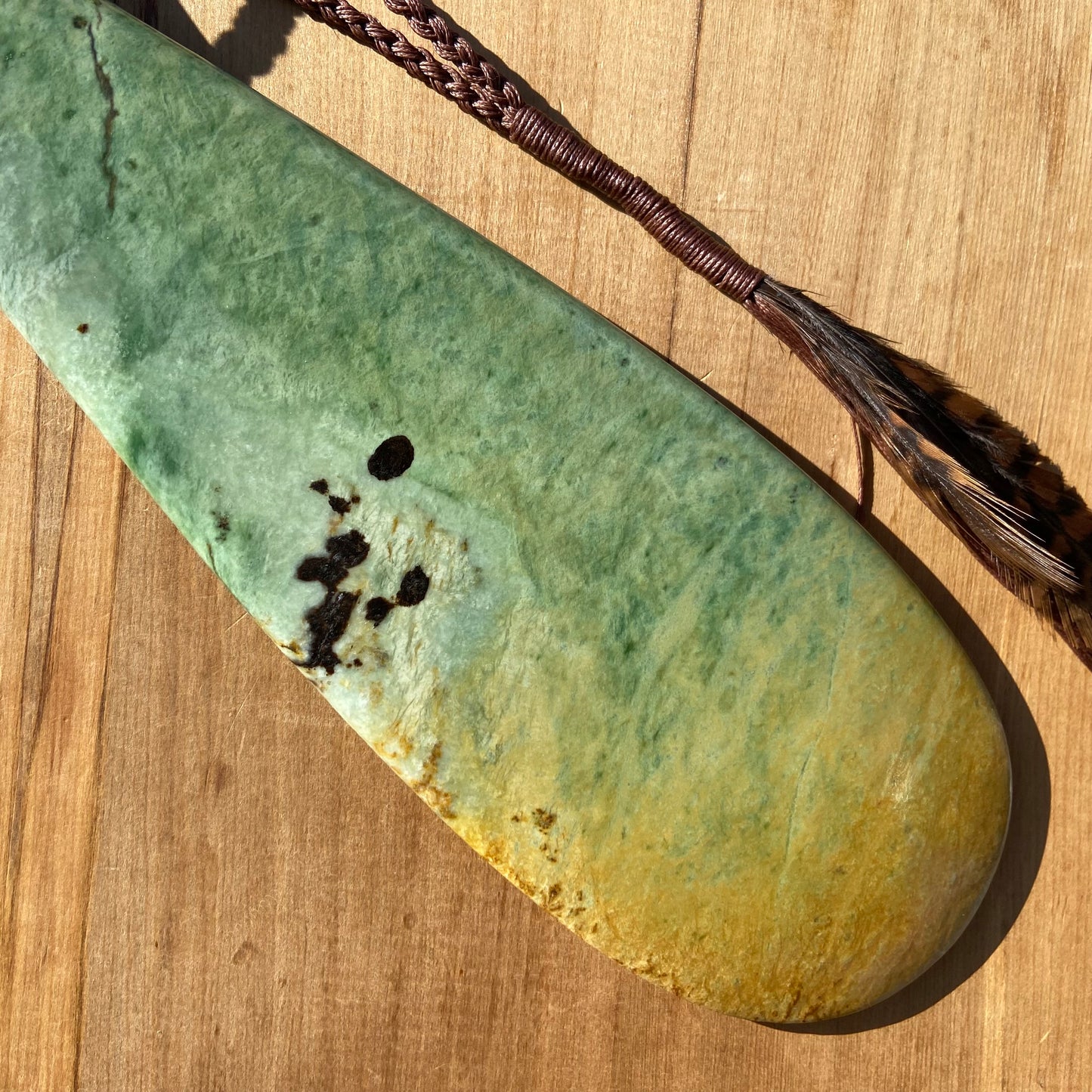 Pounamu mere hand-carved from Marsden flower jade pounamu (greenstone). Back.