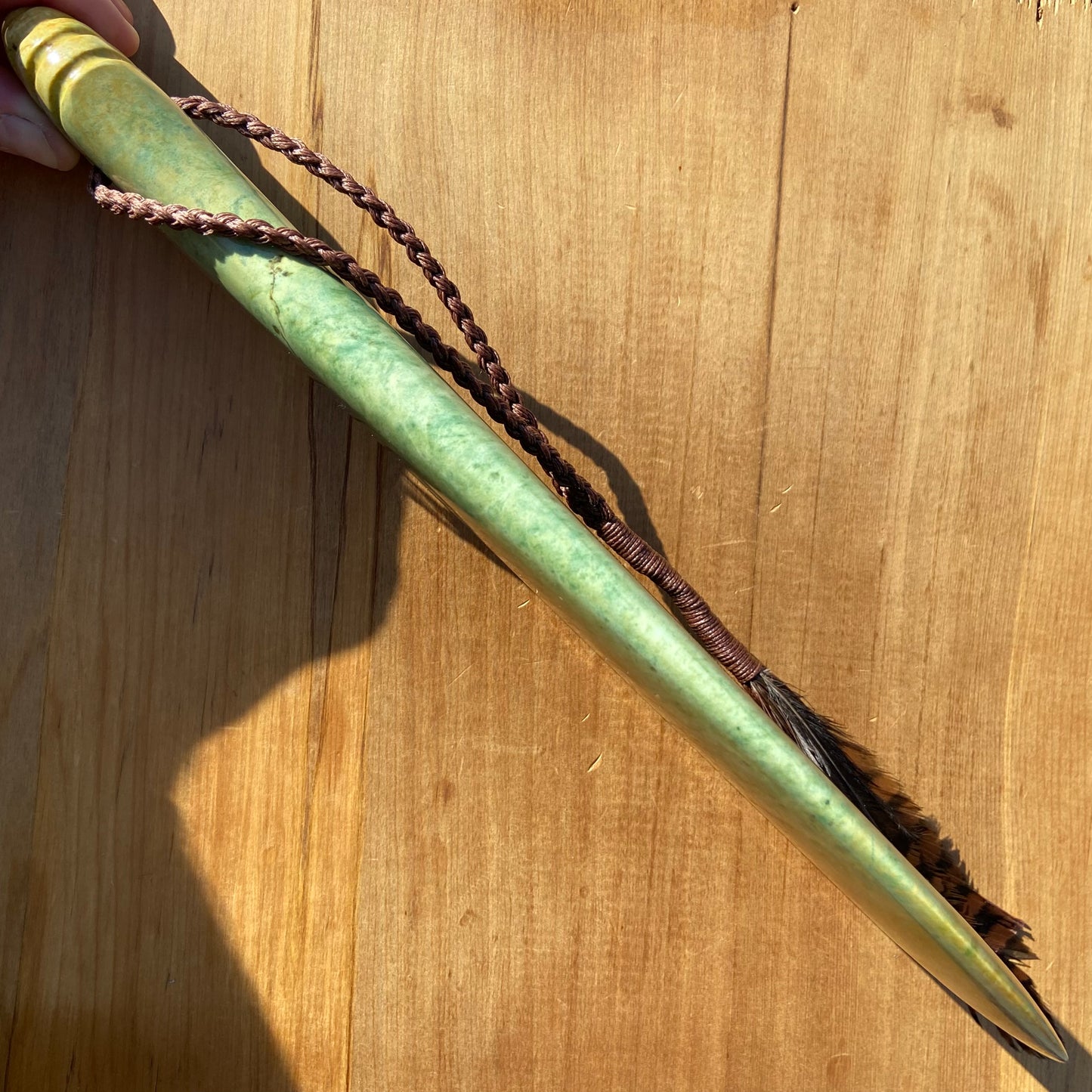 Pounamu mere hand-carved from Marsden flower jade pounamu (greenstone). Edge.