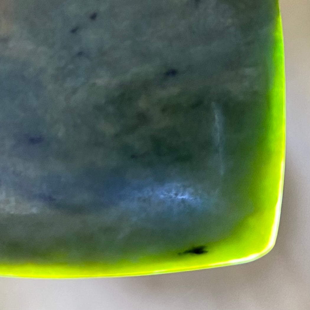 Pounamu heart shape pendant carved from New Zealand Marsden Flower Jade (greenstone). Translucency.