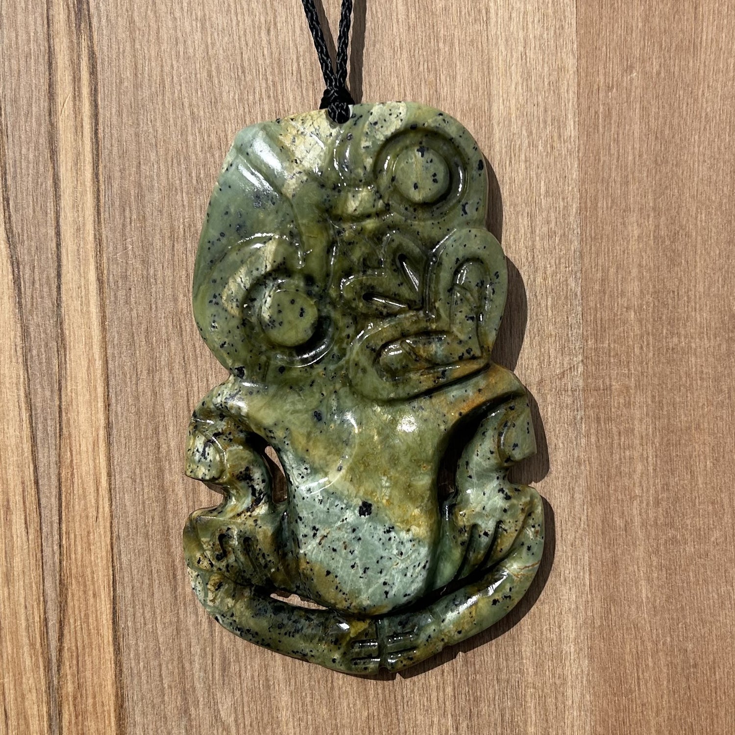 Hei tiki pendant carved from NZ pounamu