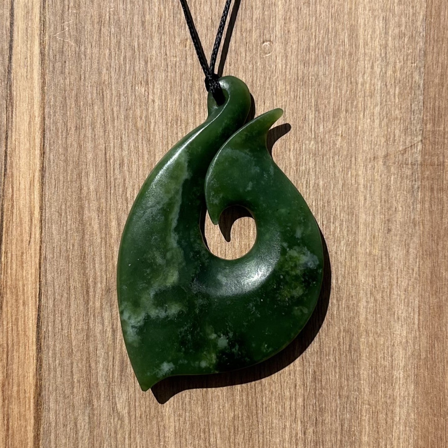 Hei Matau fish hook pendant carved from NZ jade pounamu