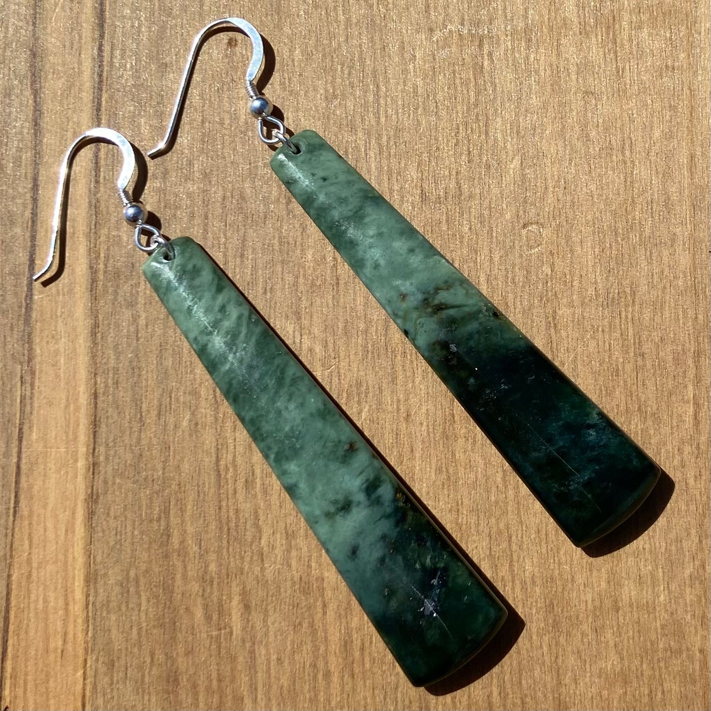 Pair of toki earrings hand-carved from New Zealand Kawakawa Jade/ pounamu (greenstone), with silver fittings. Back 