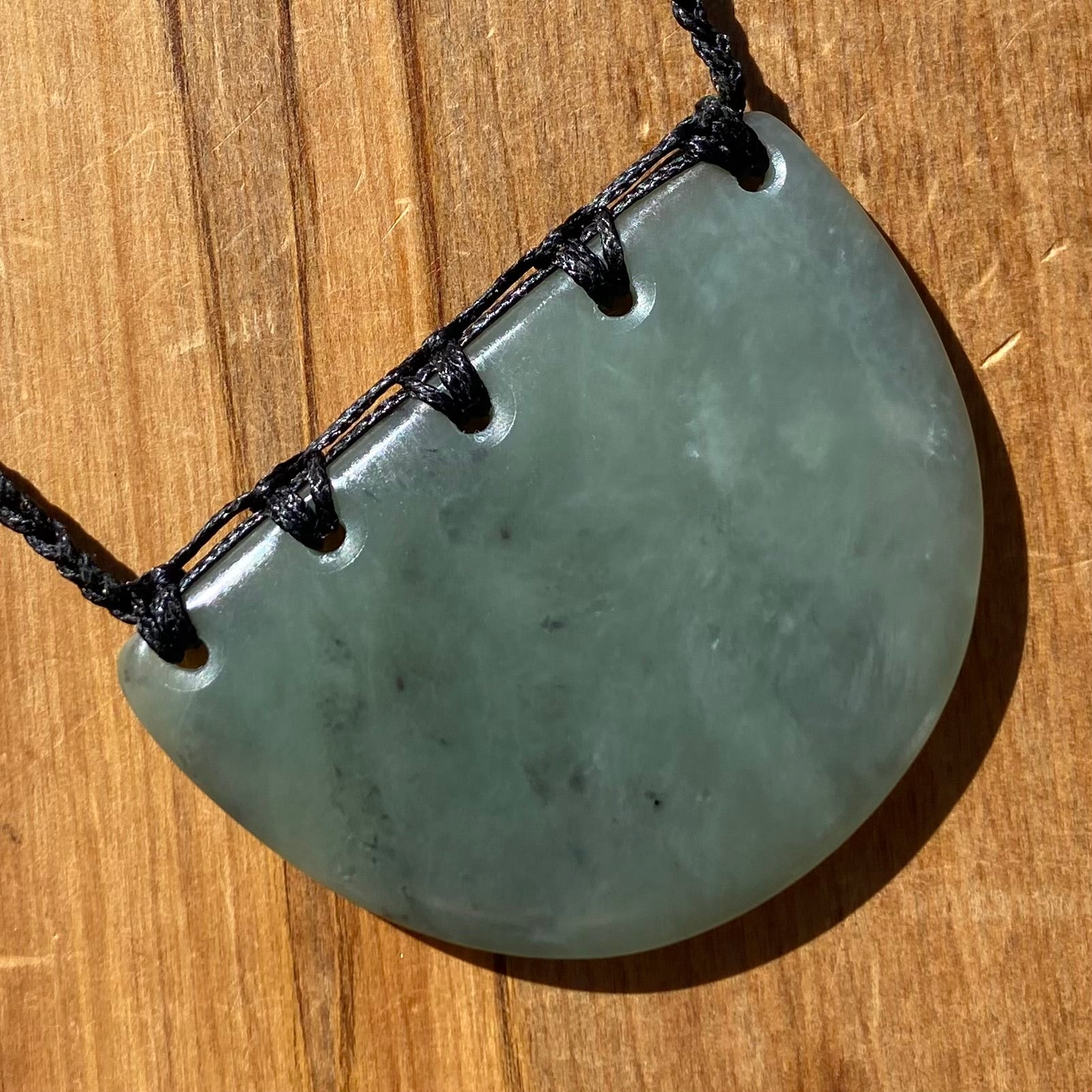 Breastplate pendant hand-carved from New Zealand inanga pounamu (greenstone). Back