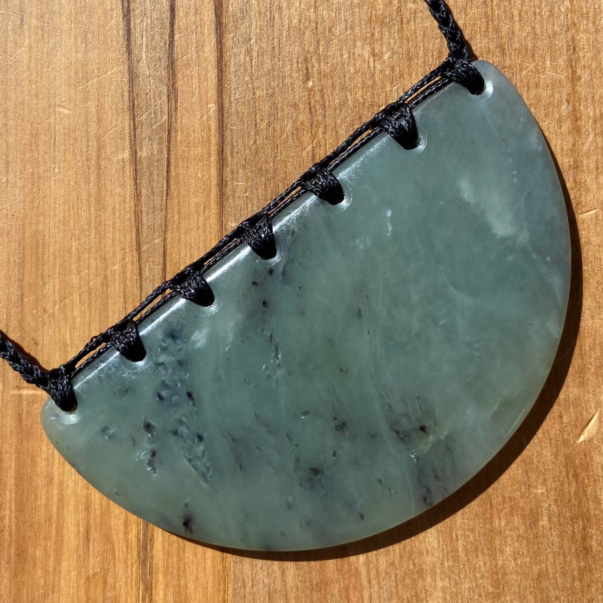 Breastplate pendant hand-carved from New Zealand inanga pounamu (greenstone). Back.