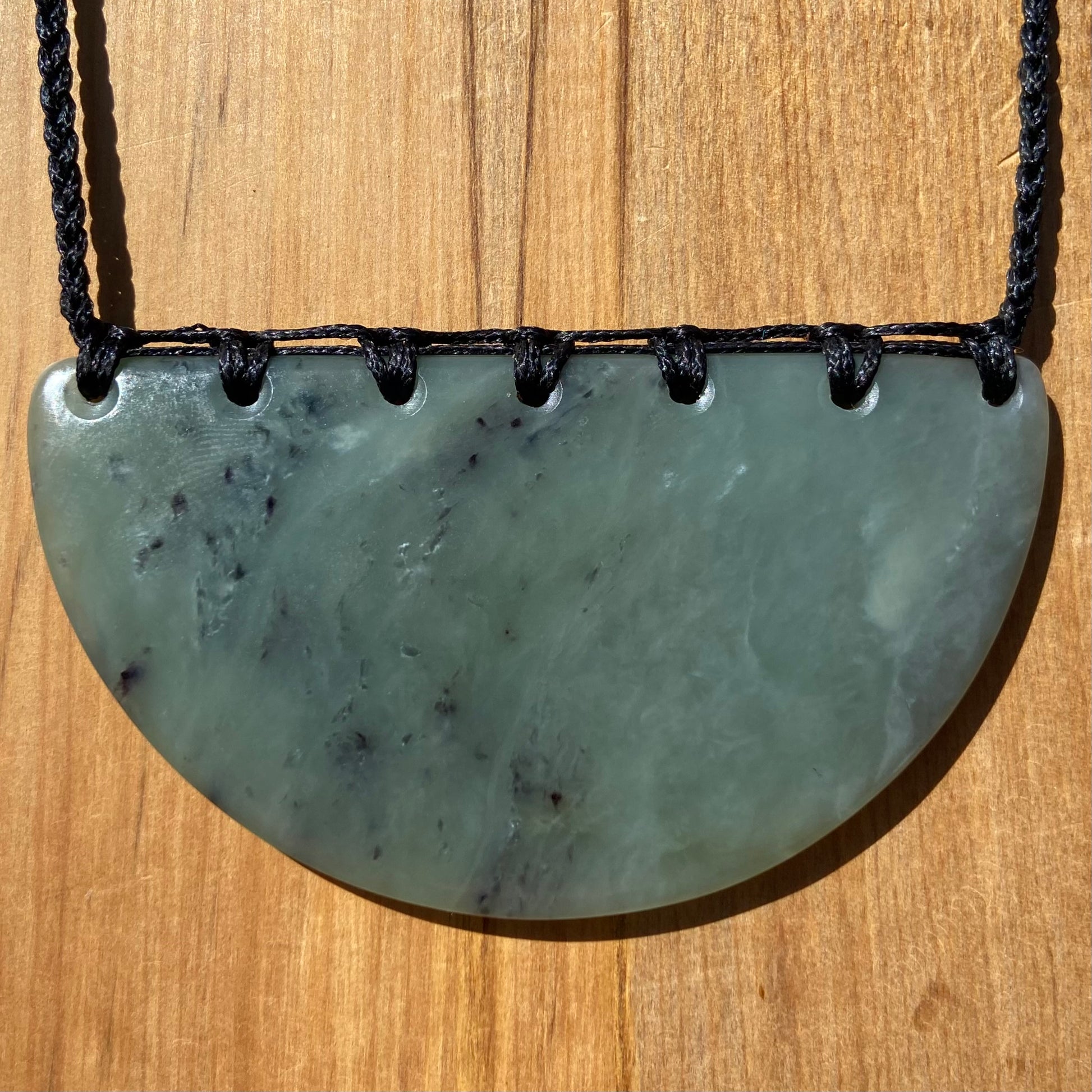 Breastplate pendant hand-carved from New Zealand inanga pounamu (greenstone). Back.