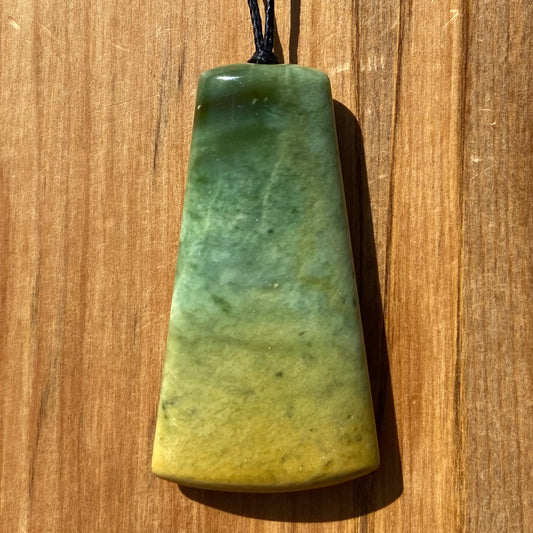 Pounamu toki pendant hand-carved from New Zealand Marsden Flower Jade pounamu (greenstone). Front.