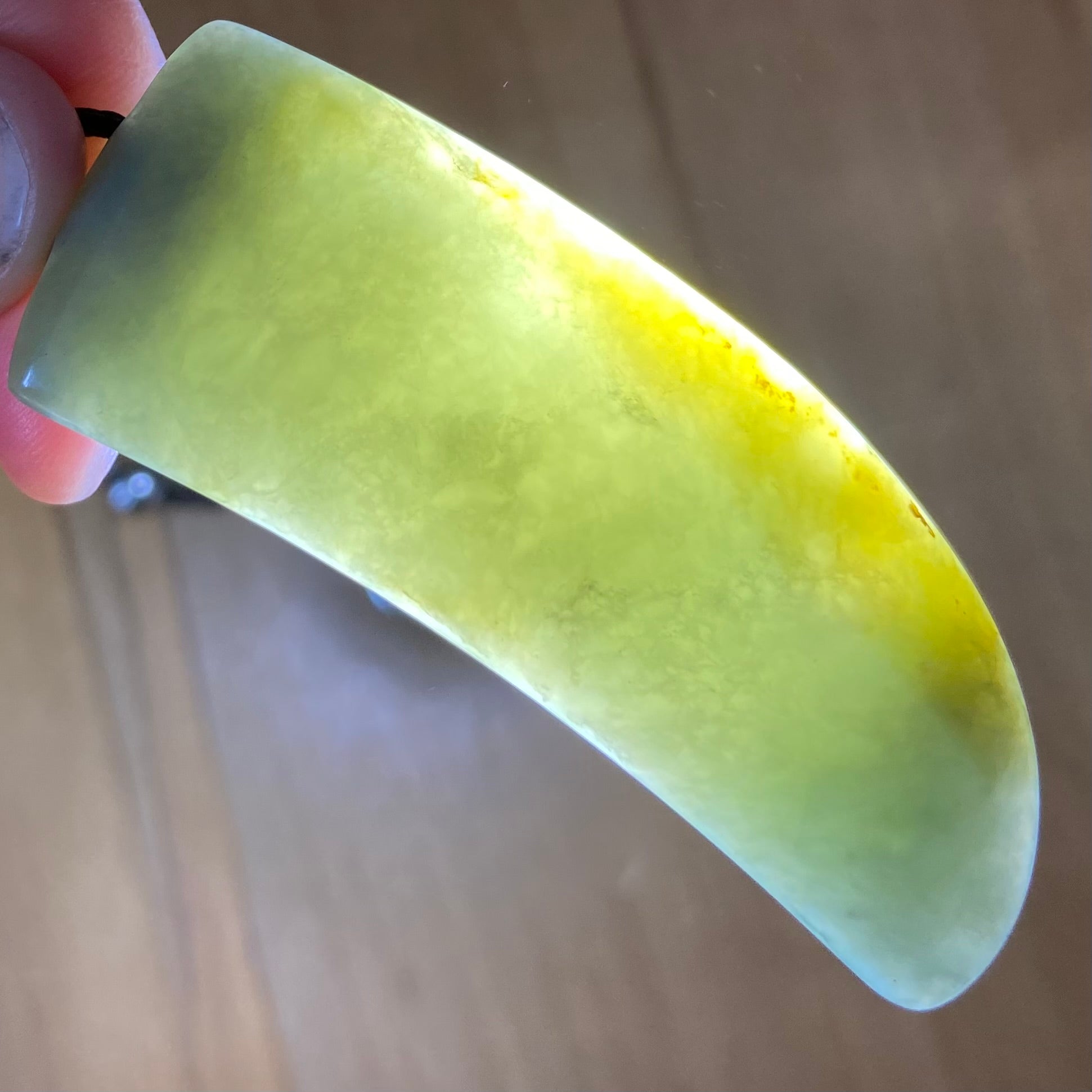 Niho Tooth pendant hand-carved from New Zealand inanga pounamu (greenstone). Translucency.