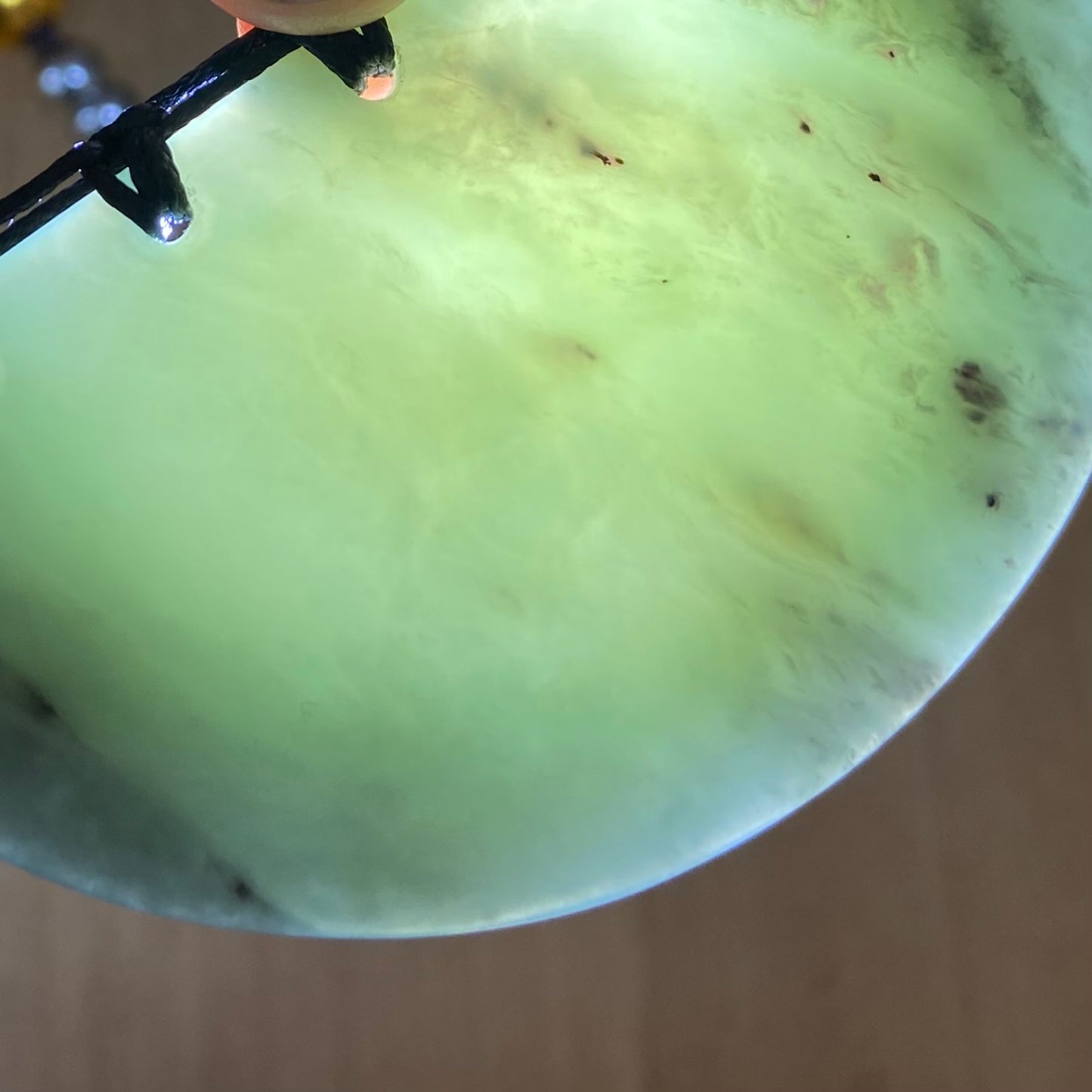 Breastplate pendant hand-carved from New Zealand inanga pounamu (greenstone). Translucency.