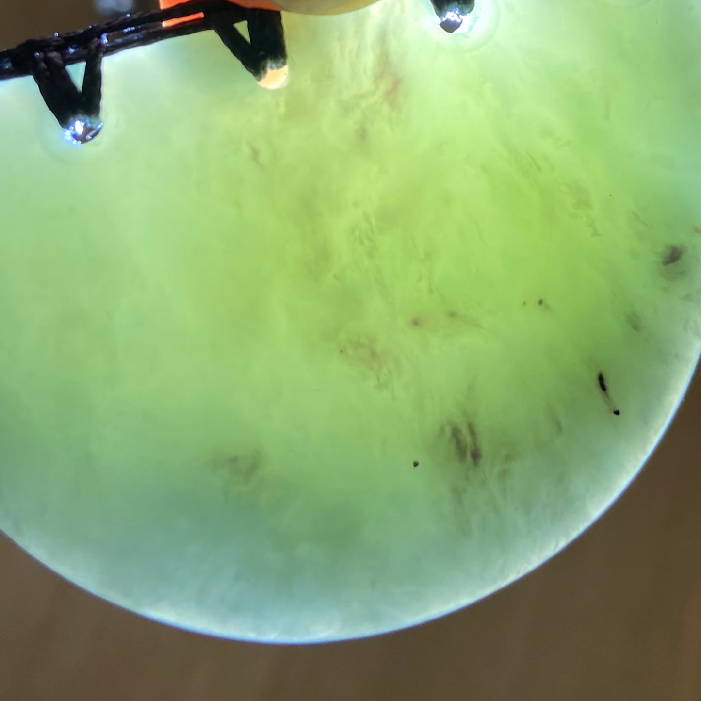 Breastplate pendant hand-carved from New Zealand inanga pounamu (greenstone). Translucency.