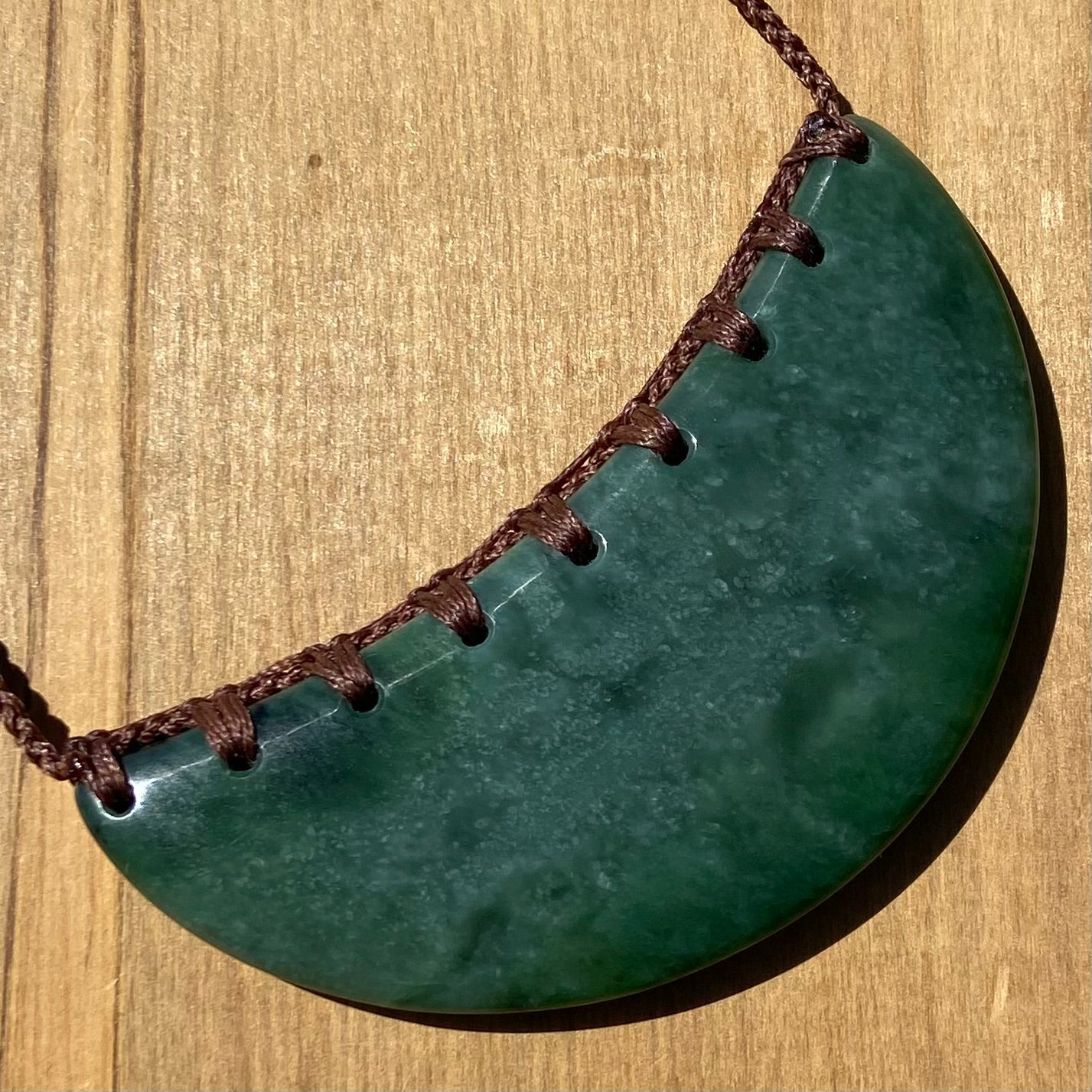 Breastplate pendant hand-carved from New Zealand kahurangi pounamu (greenstone). Back.