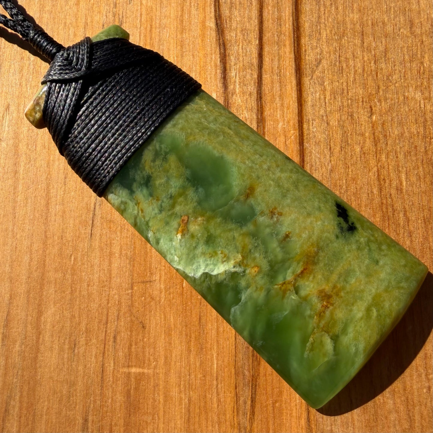 Bound pounamu toki pendant hand-carved from New Zealand Marsden Flower Jade pounamu (greenstone). Front