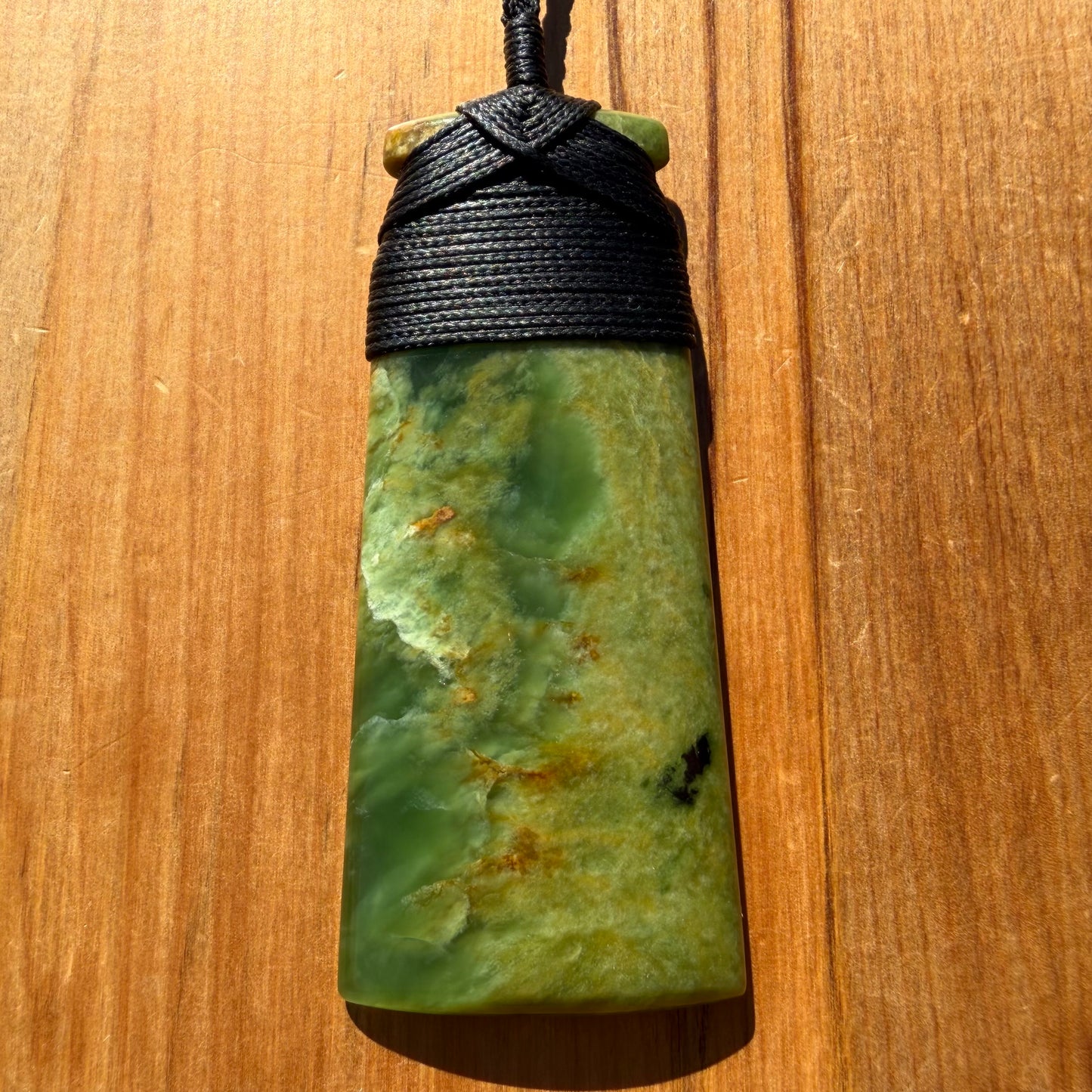 Bound pounamu toki pendant hand-carved from New Zealand Marsden Flower Jade pounamu (greenstone). Front