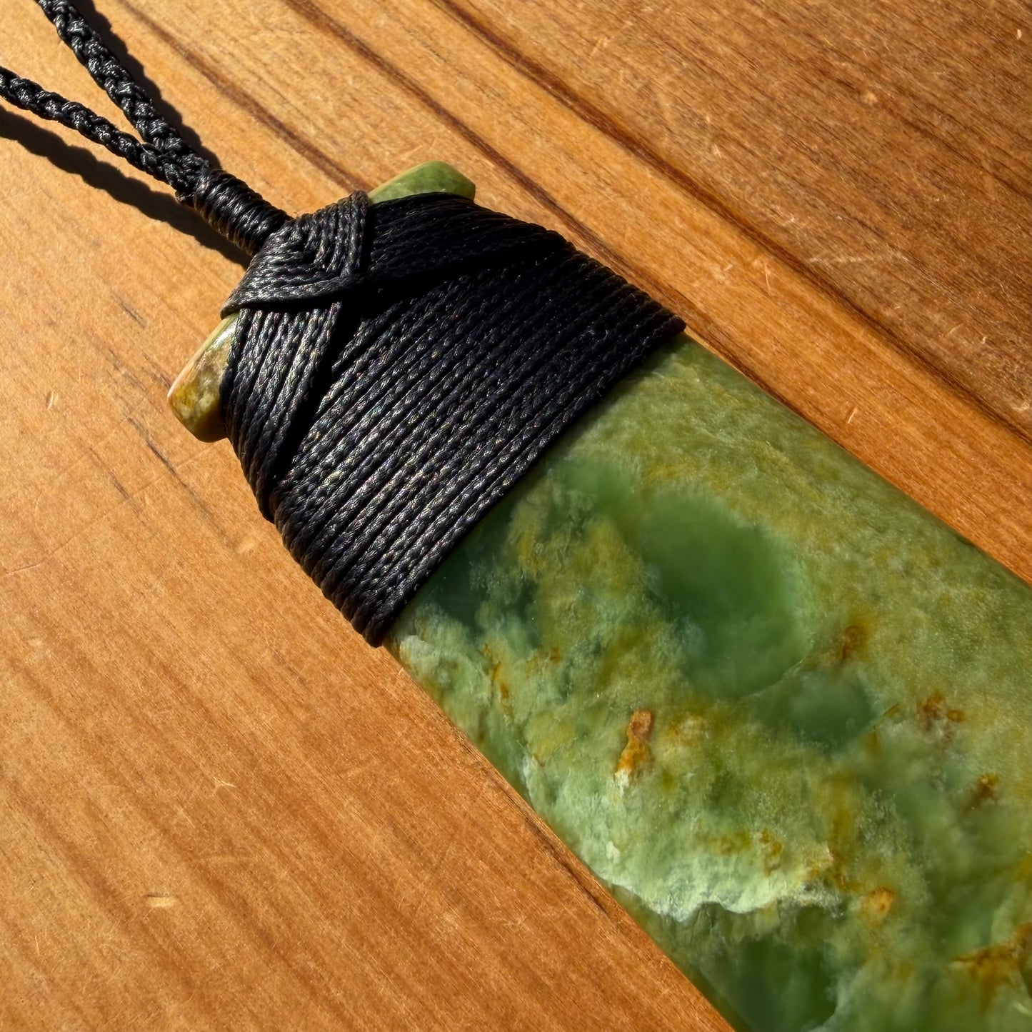 Bound pounamu toki pendant hand-carved from New Zealand Marsden Flower Jade pounamu (greenstone). Binding
