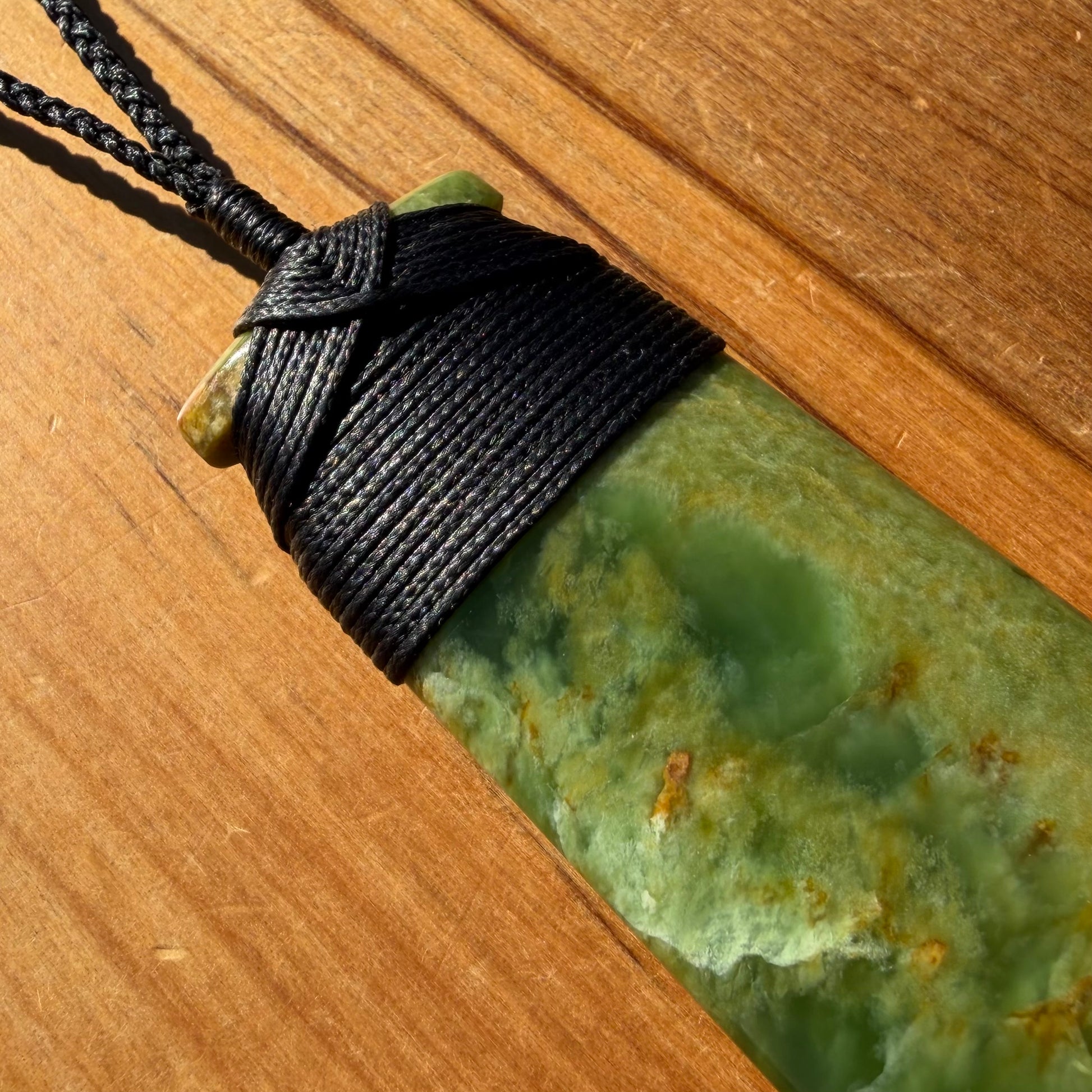 Bound pounamu toki pendant hand-carved from New Zealand Marsden Flower Jade pounamu (greenstone). Binding