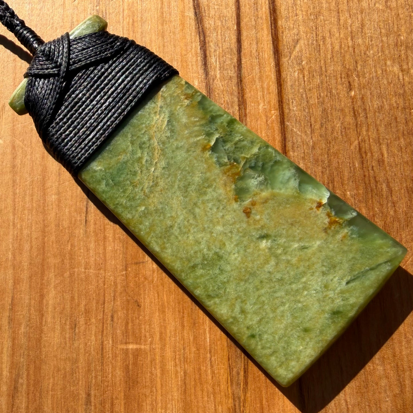 Bound pounamu toki pendant hand-carved from New Zealand Marsden Flower Jade pounamu (greenstone). Back