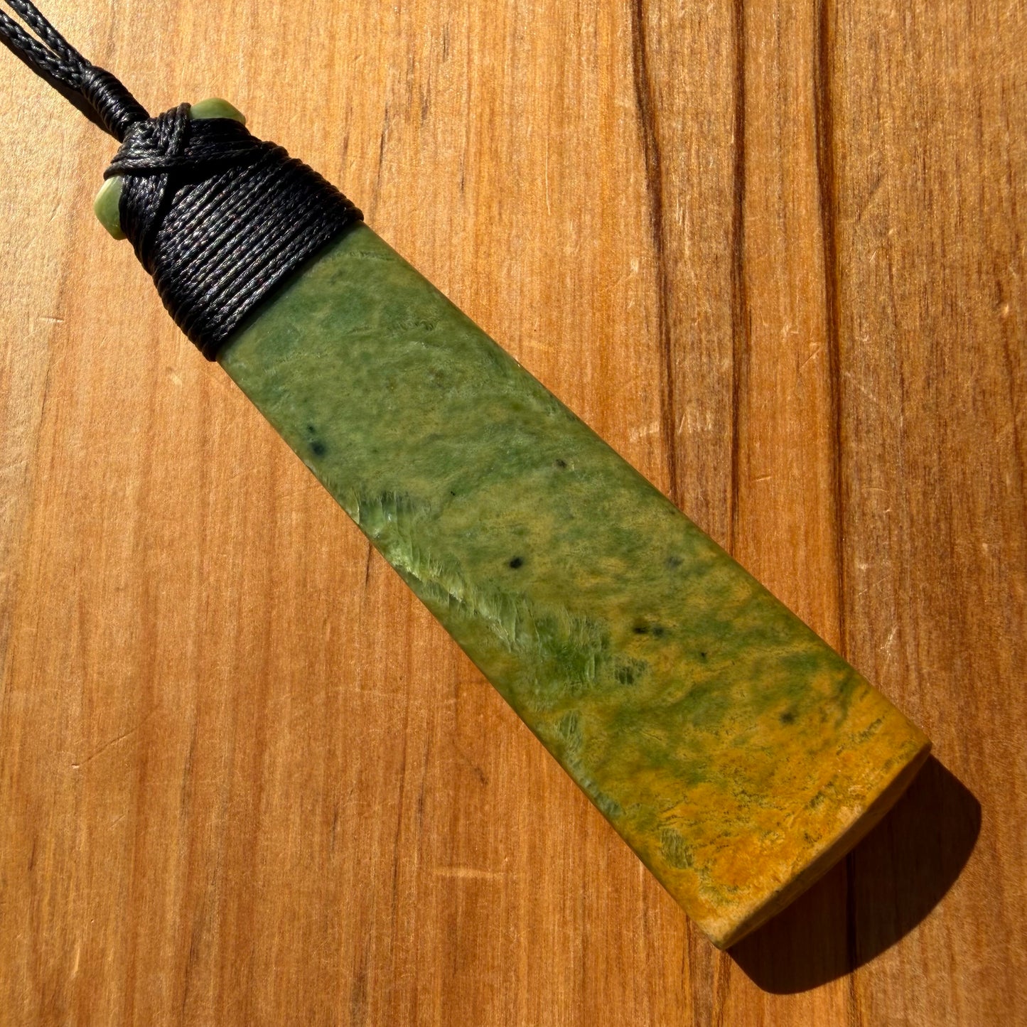 Bound pounamu toki pendant hand-carved from New Zealand Marsden Flower Jade pounamu (greenstone). Front