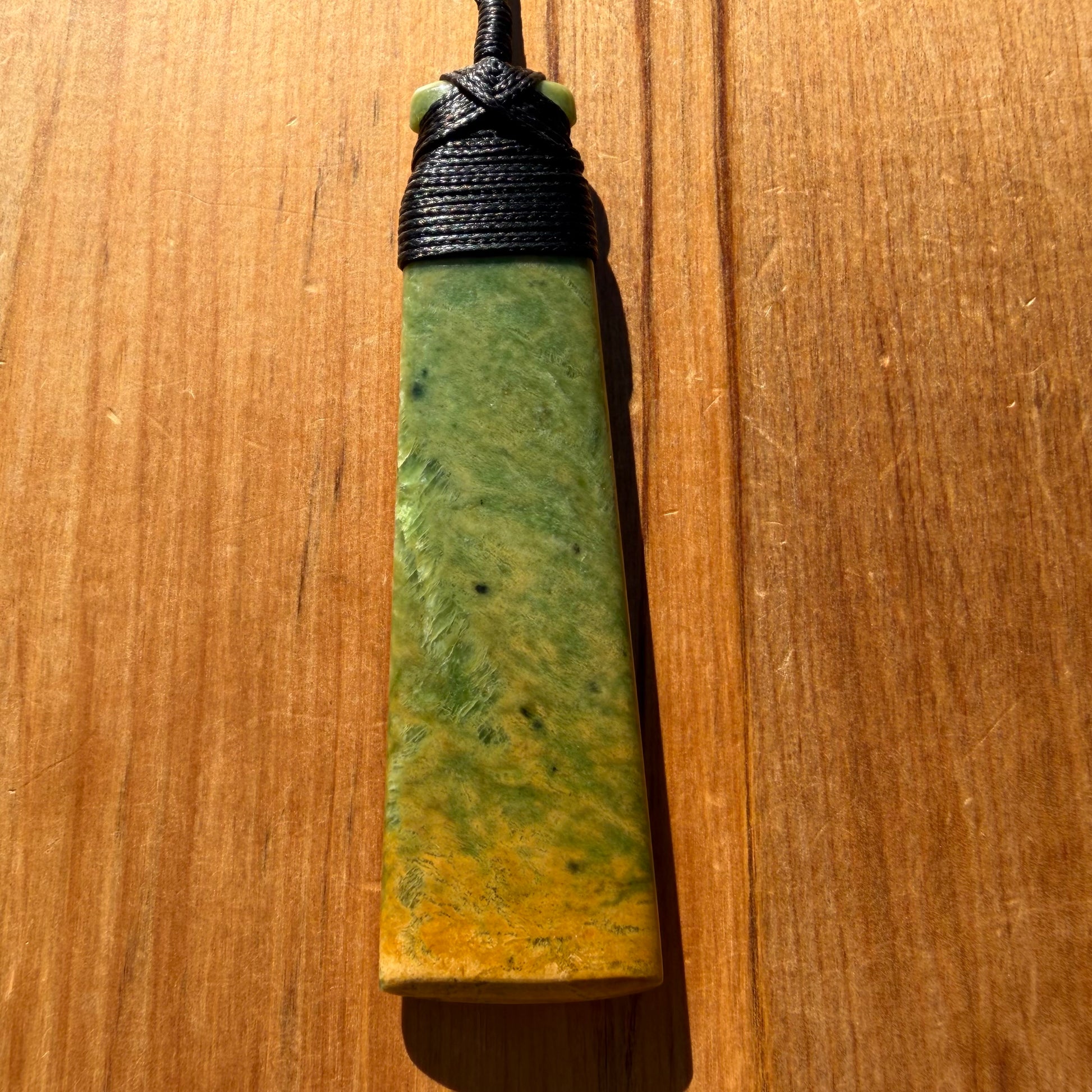 Bound pounamu toki pendant hand-carved from New Zealand Marsden Flower Jade pounamu (greenstone). Front