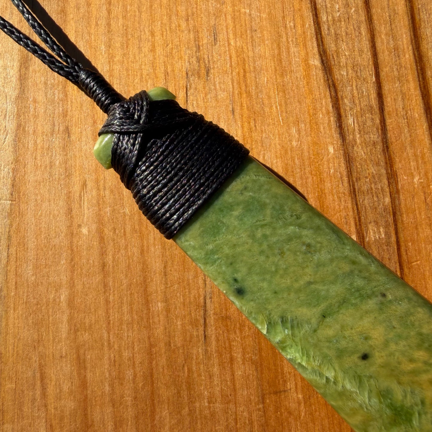 Bound pounamu toki pendant hand-carved from New Zealand Marsden Flower Jade pounamu (greenstone). Binding