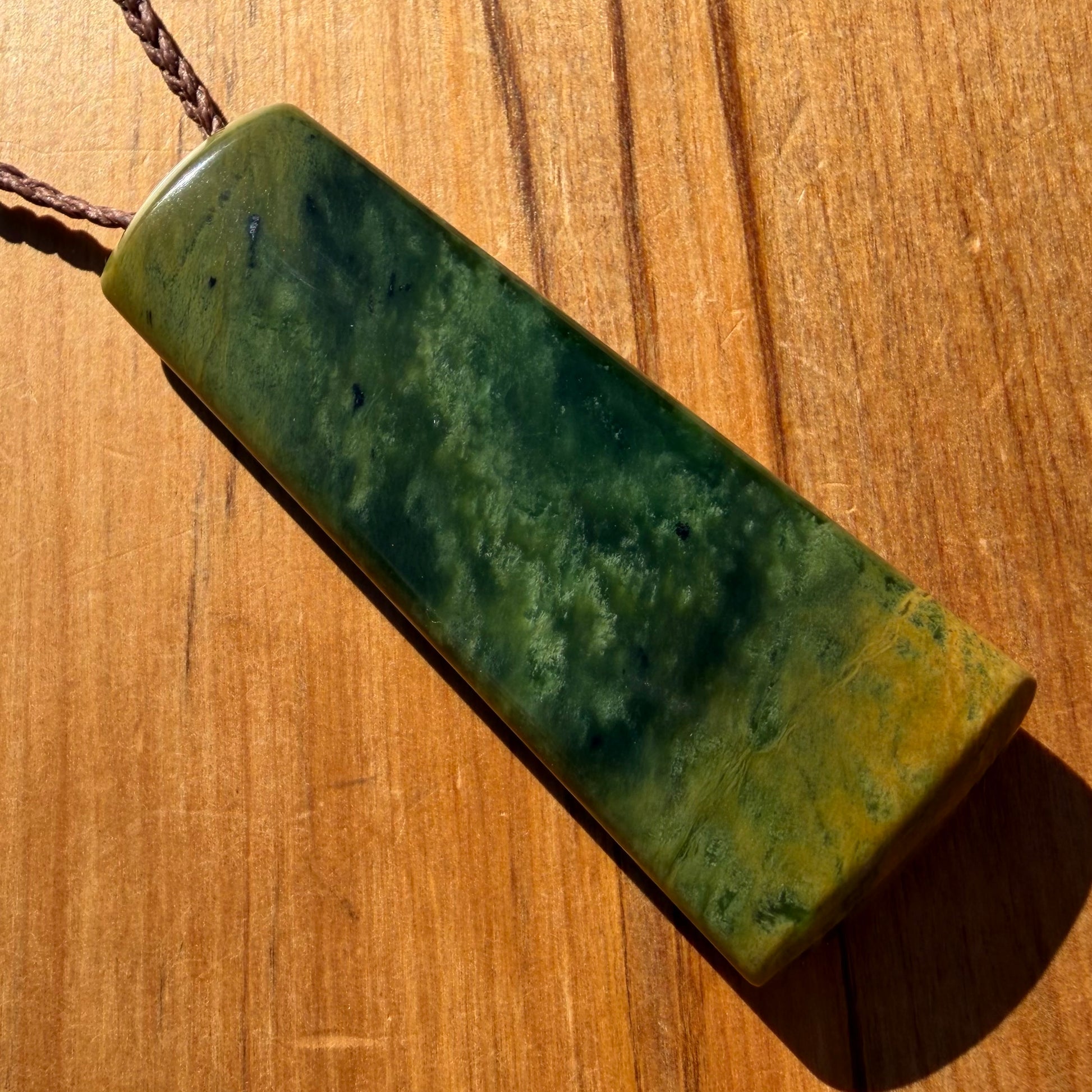 Pounamu toki pendant hand-carved from New Zealand Marsden Flower Jade pounamu (greenstone). Front