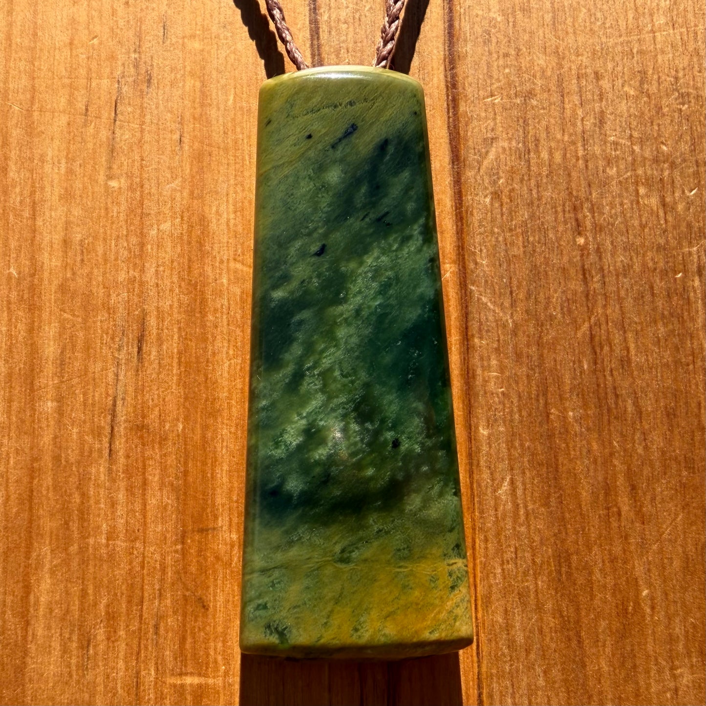Pounamu toki pendant hand-carved from New Zealand Marsden Flower Jade pounamu (greenstone). Front