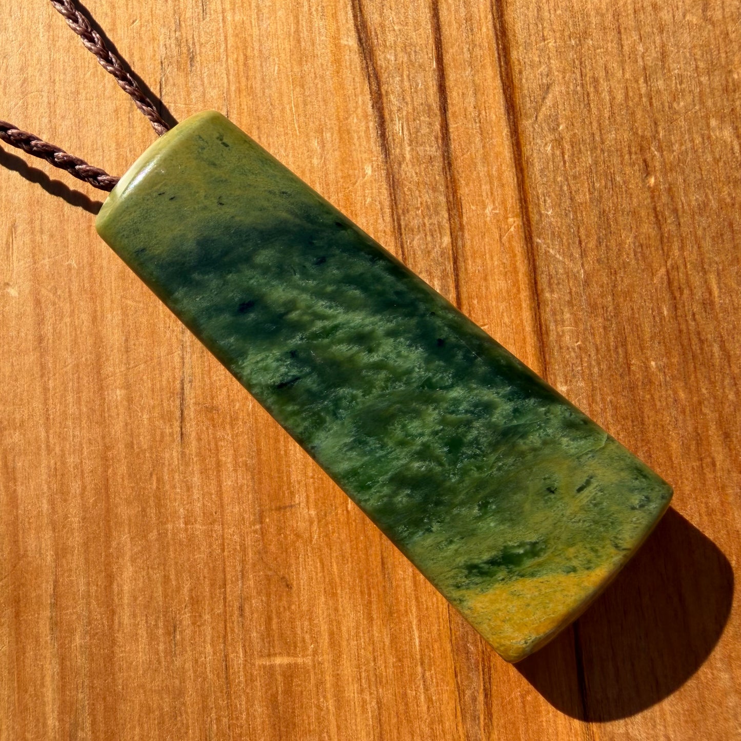 Pounamu toki pendant hand-carved from New Zealand Marsden Flower Jade pounamu (greenstone). Front