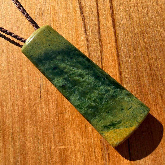 Pounamu toki pendant hand-carved from New Zealand Marsden Flower Jade pounamu (greenstone). Front