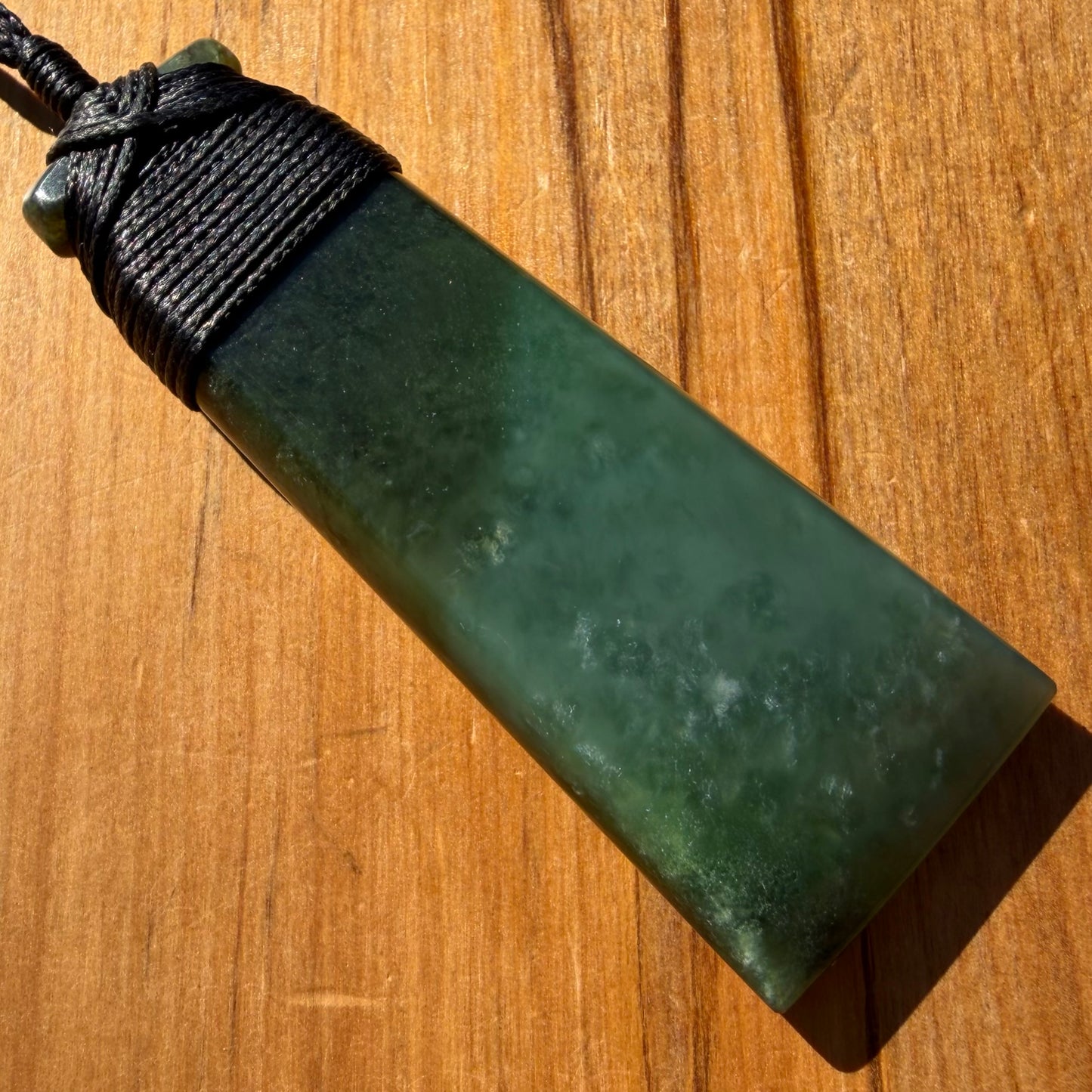 Bound toki pendant hand-carved from NZ Kahurangi pounamu (greenstone). Front.