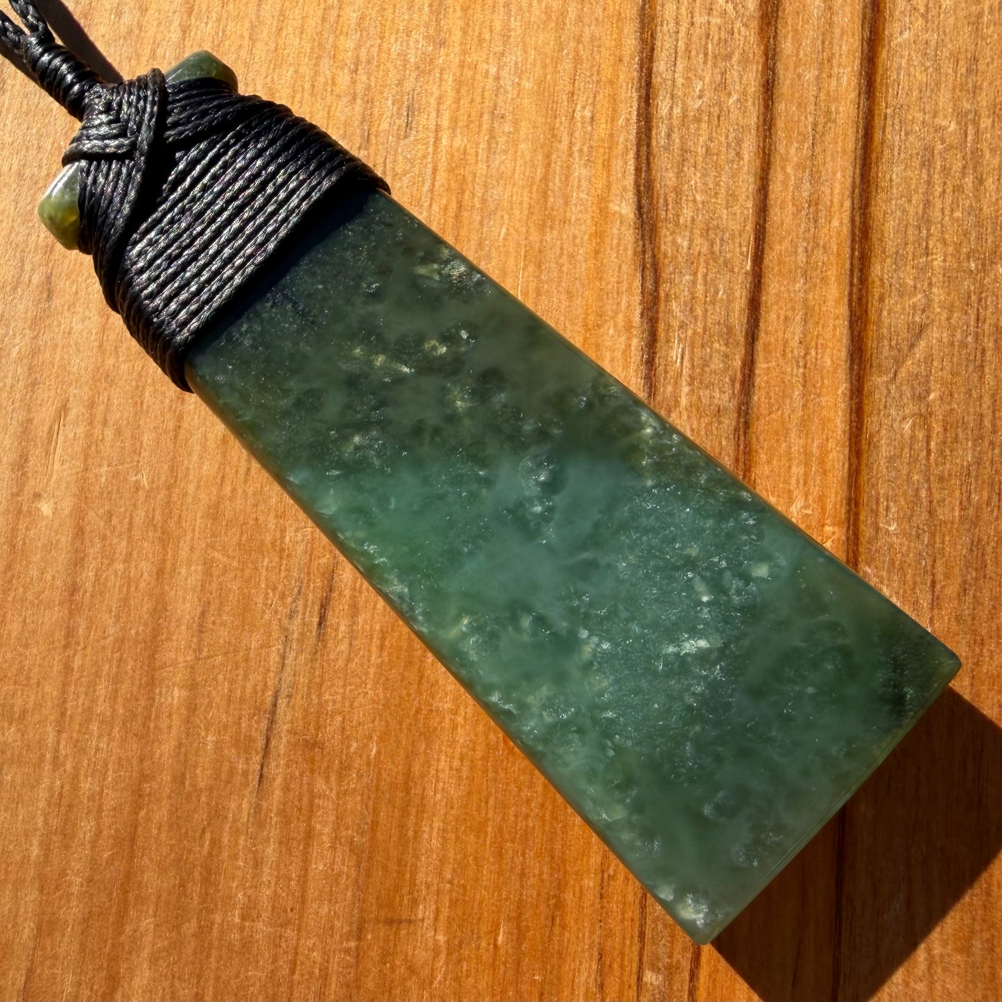 Bound toki pendant hand-carved from NZ Kahurangi pounamu (greenstone). Back.