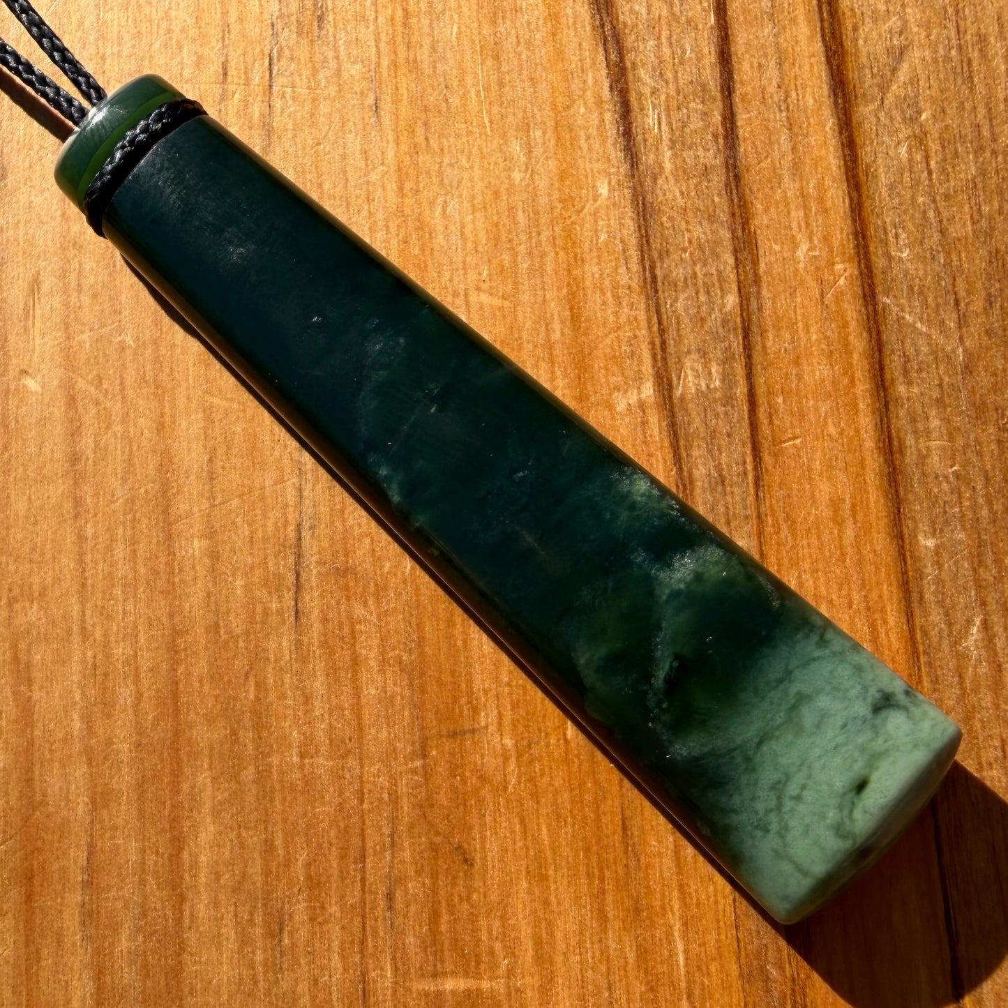 Pounamu toki from New Zealand Kawakawa pounamu (greenstone). Front.
