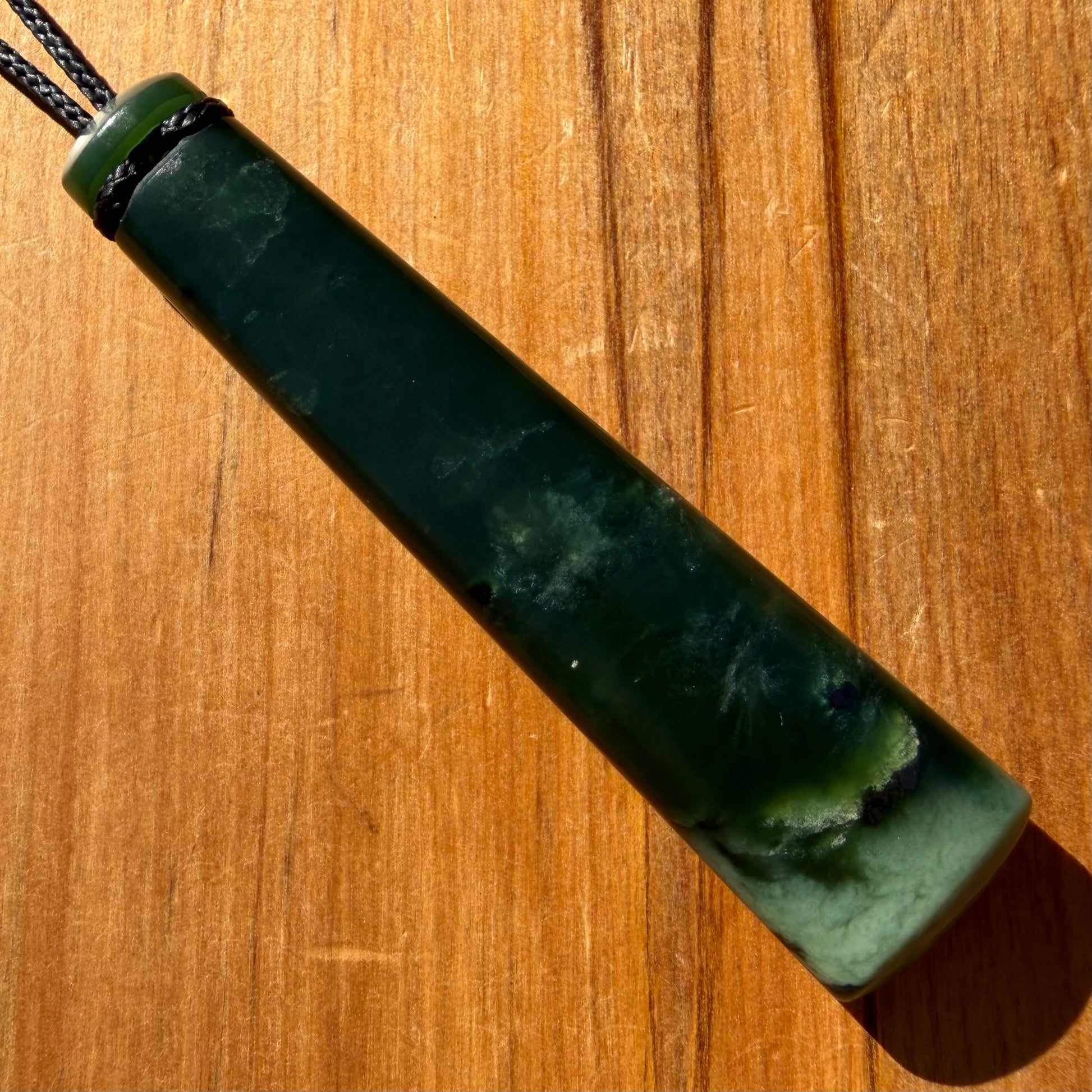 Pounamu toki from New Zealand Kawakawa pounamu (greenstone). Back.