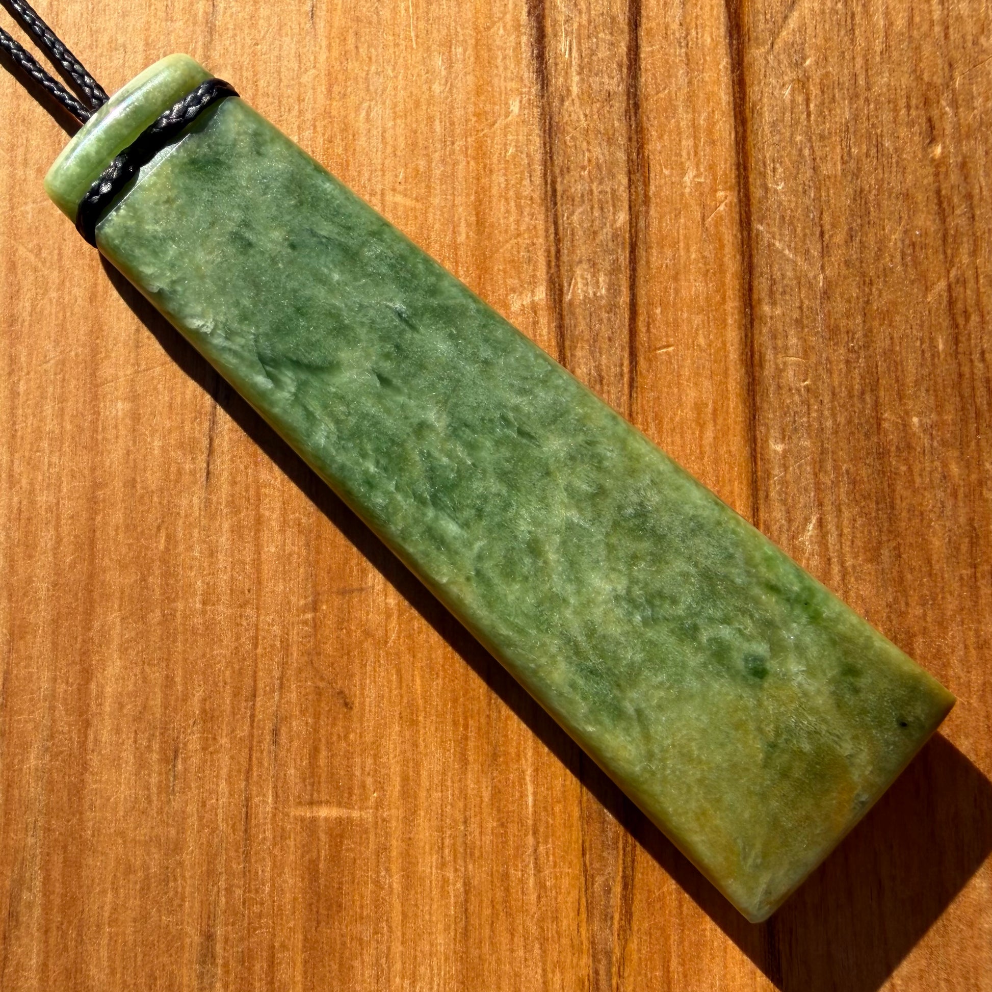 Pounamu toki from NZ Marsden Flower Jade pounamu (greenstone). Back.