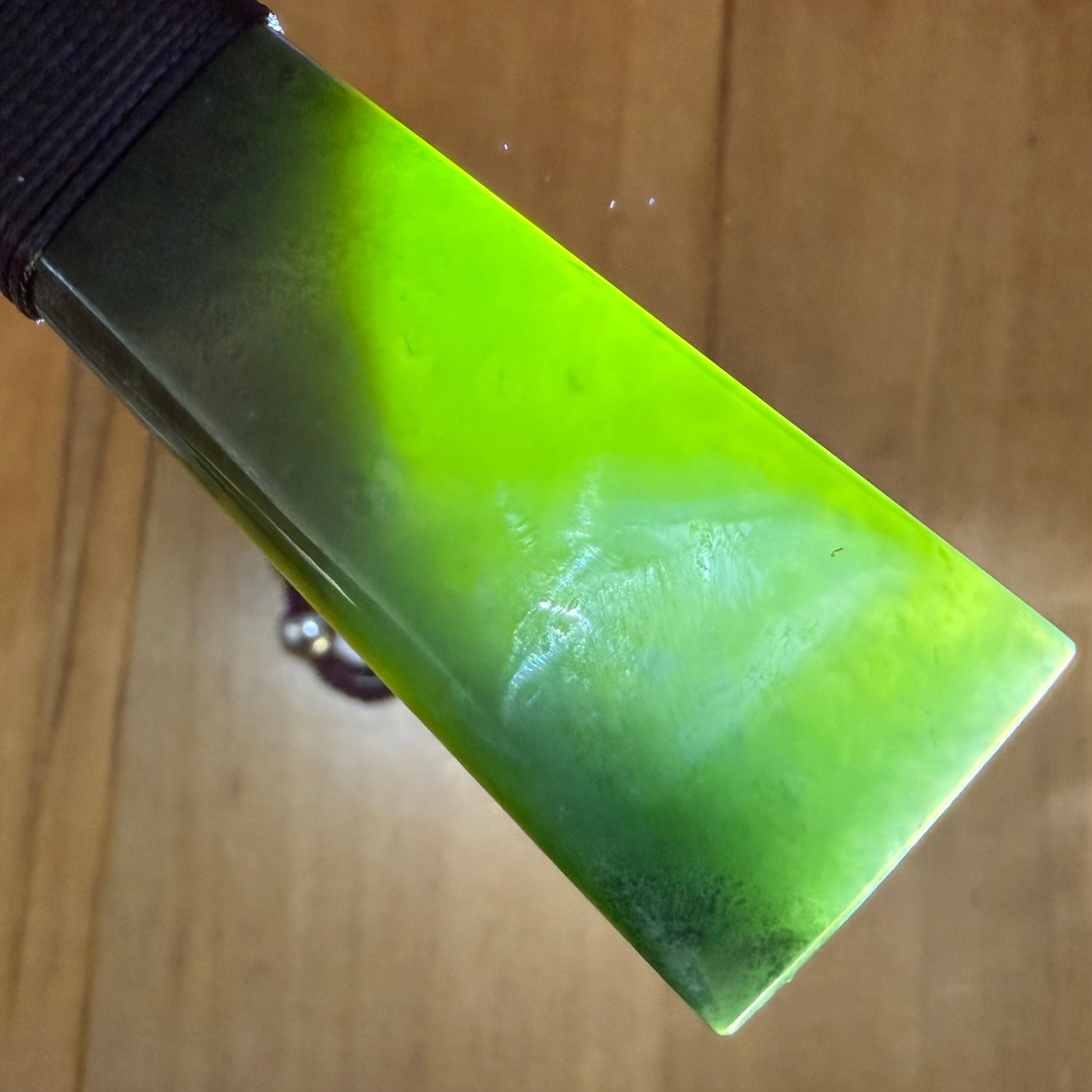 Bound toki pendant hand-carved from NZ Kahurangi pounamu (greenstone). Translucency.