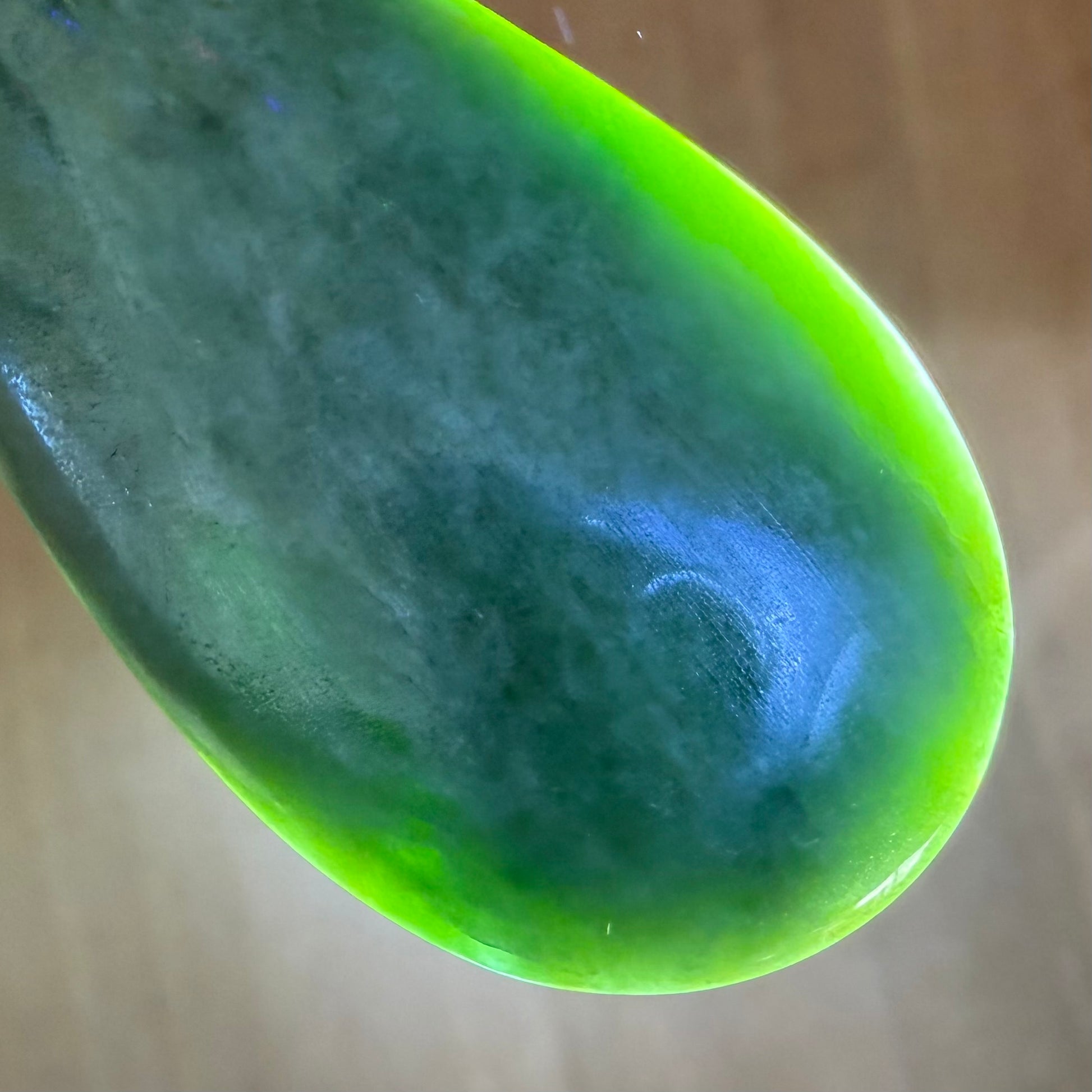 Roimata (teardrop) pendant hand-carved from New Zealand Marsden Flower Jade/ pounamu (greenstone). Translucency.