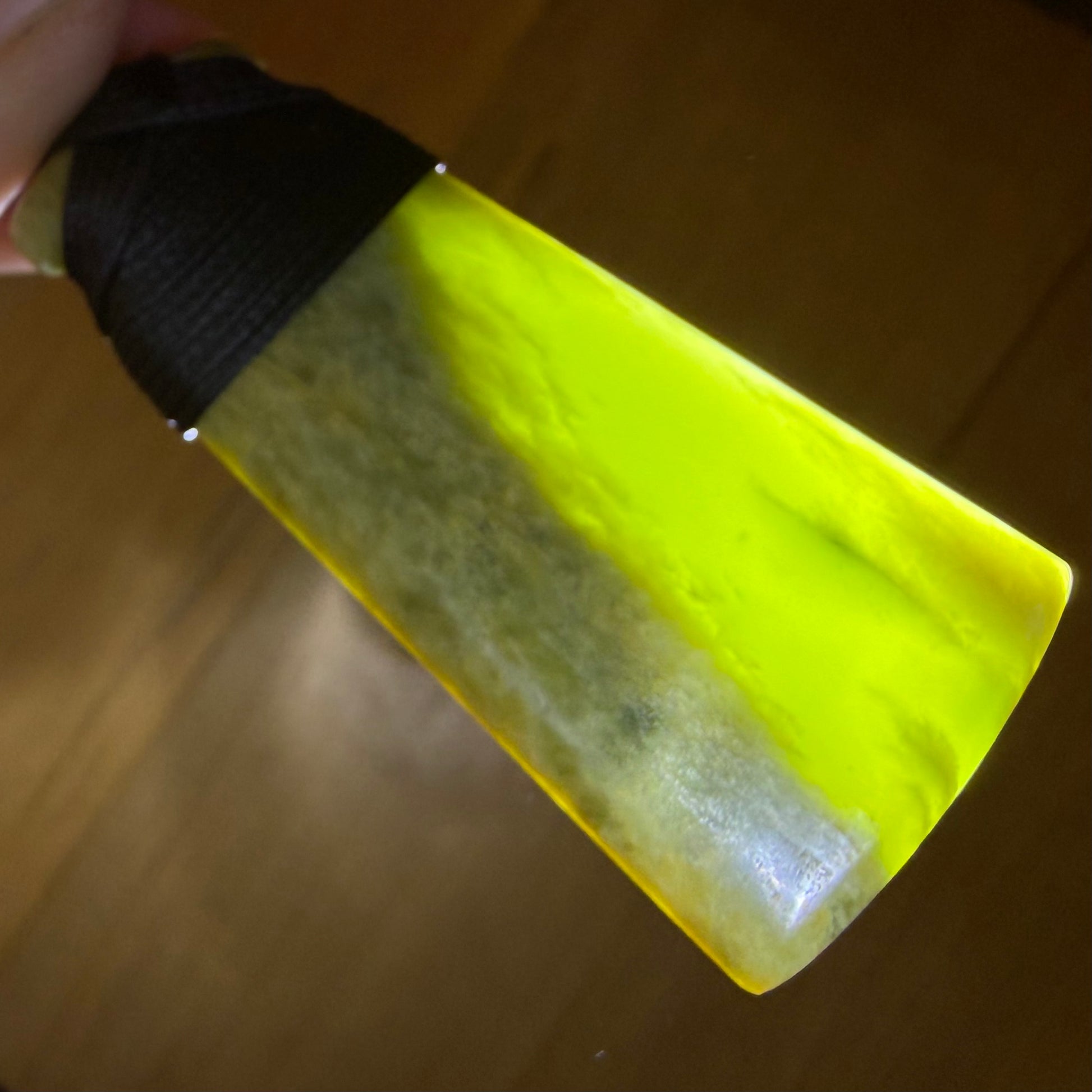 Bound pounamu toki pendant hand-carved from New Zealand Marsden Flower Jade pounamu (greenstone). Translucency.
