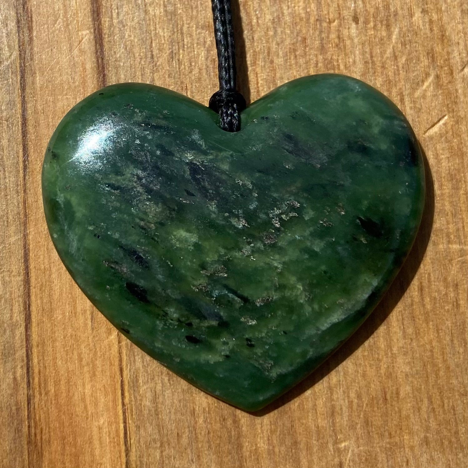Heart necklace hand-carved from NZ kawakawa pounamu (greenstone). 