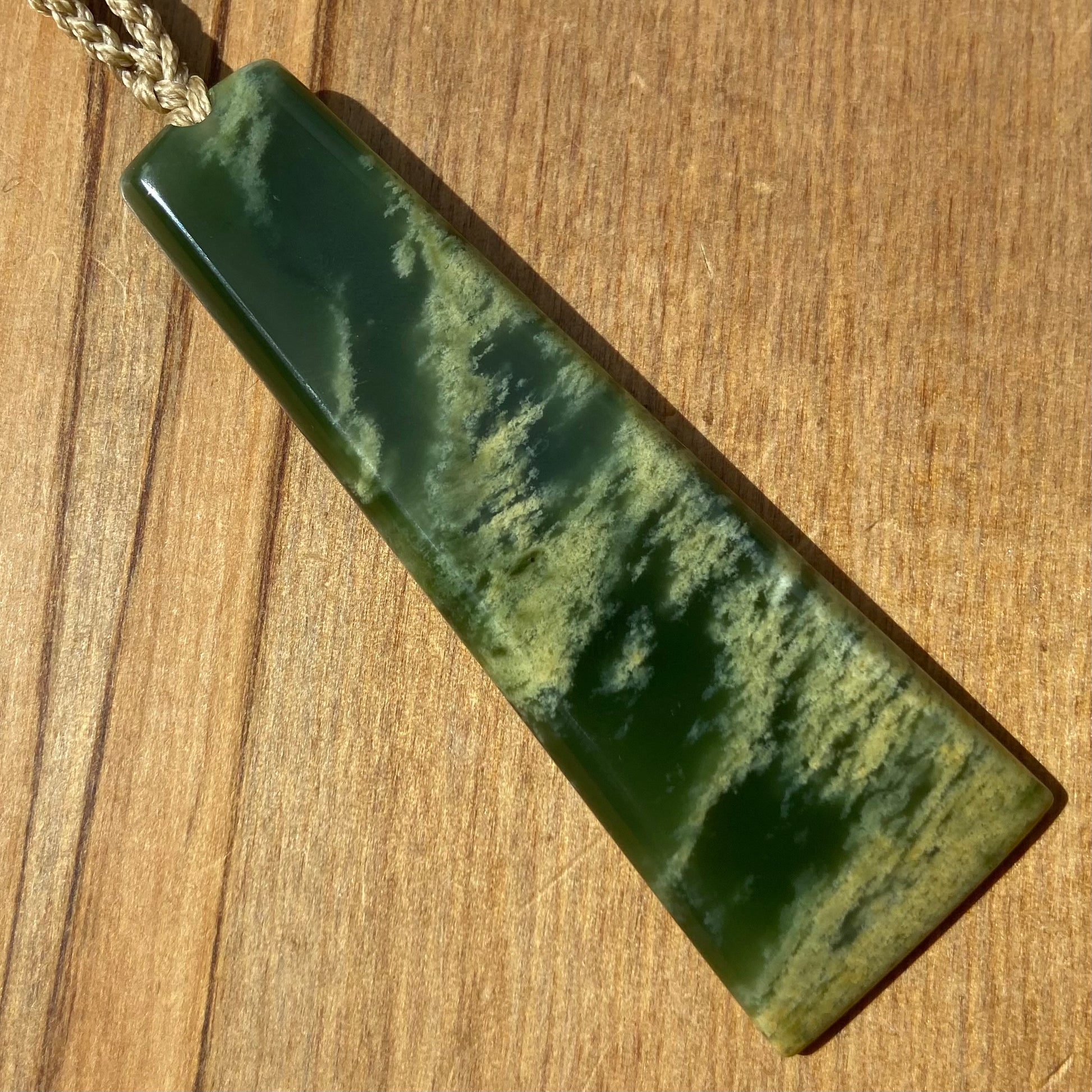 Pounamu toki pendant hand-carved from New Zealand Marsden Flower Jade pounamu (greenstone). Front