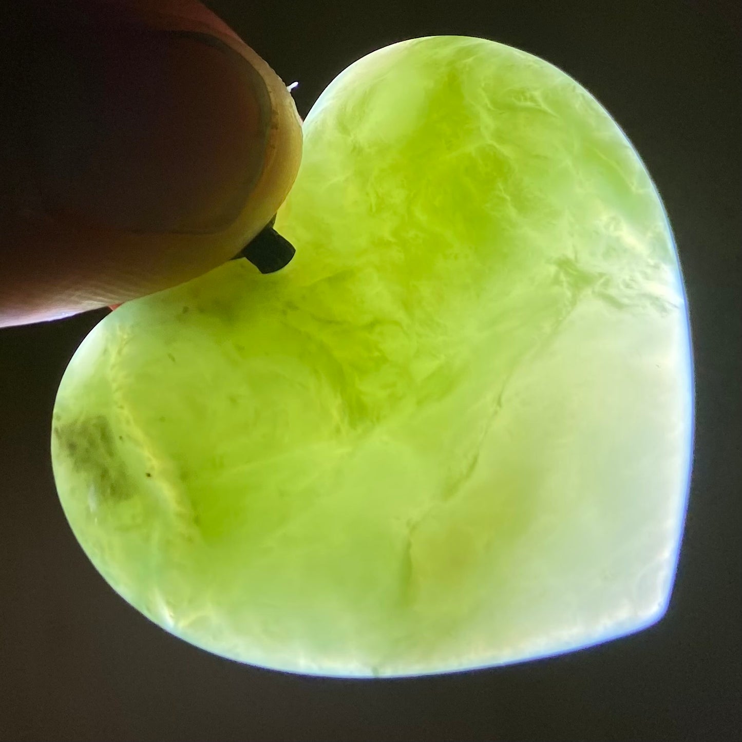 Heart necklace hand-carved from New Zealand pounamu (greenstone) Kahurangi. Translucency. 