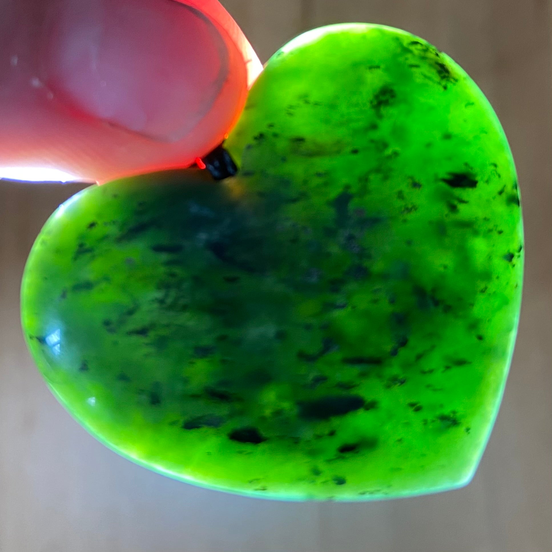Heart necklace hand-carved from NZ kawakawa pounamu (greenstone). Translucency. 