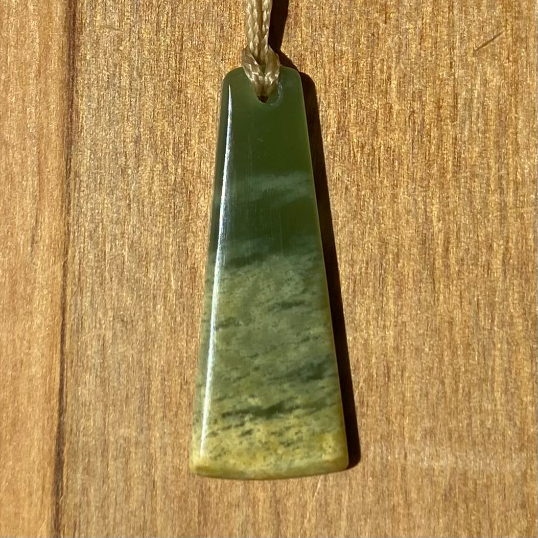 Pounamu toki pendant hand-carved from New Zealand Marsden Flower Jade pounamu (greenstone). Front