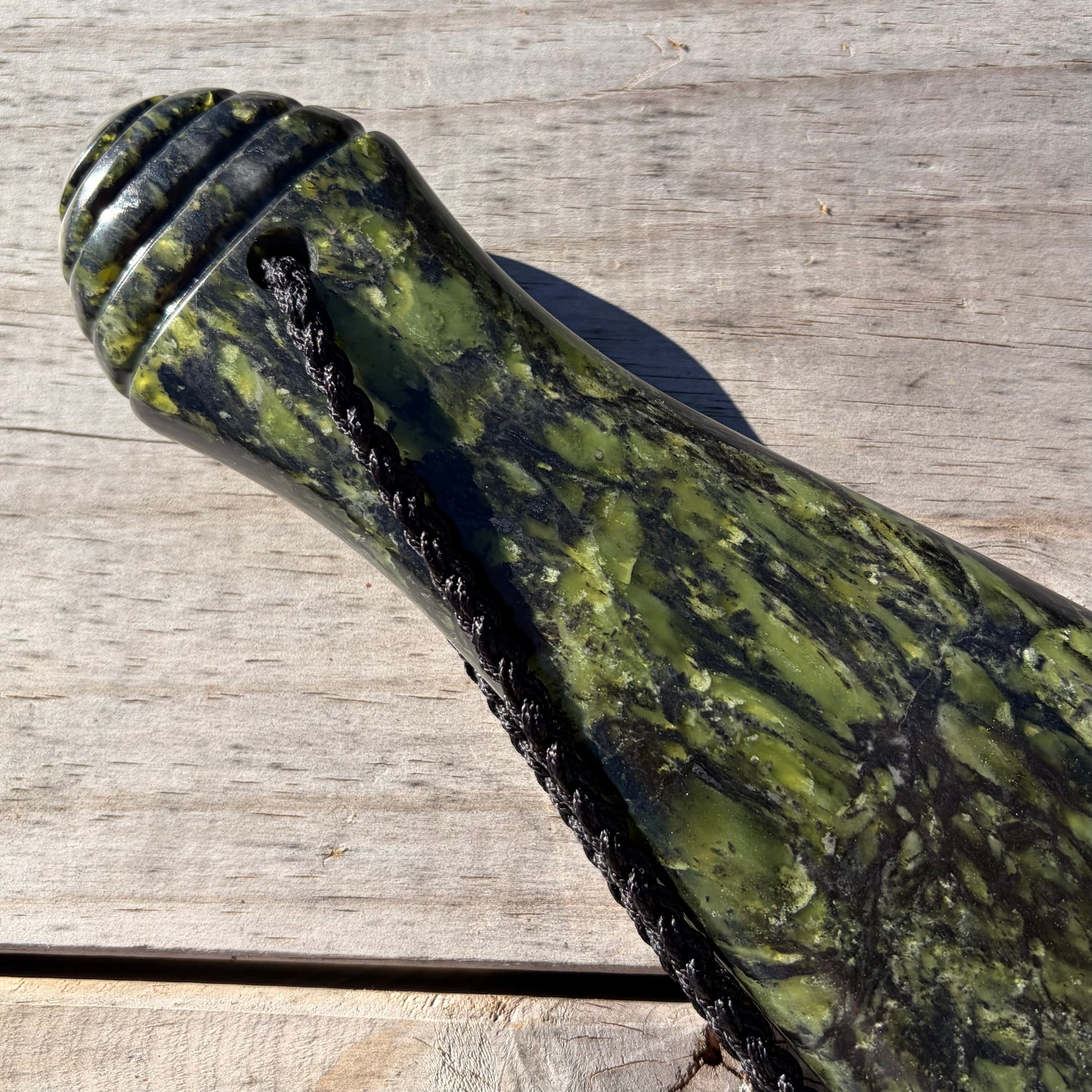 Pounamu mere hand-carved from Douglas Creek greenstone (pounamu). Handle.