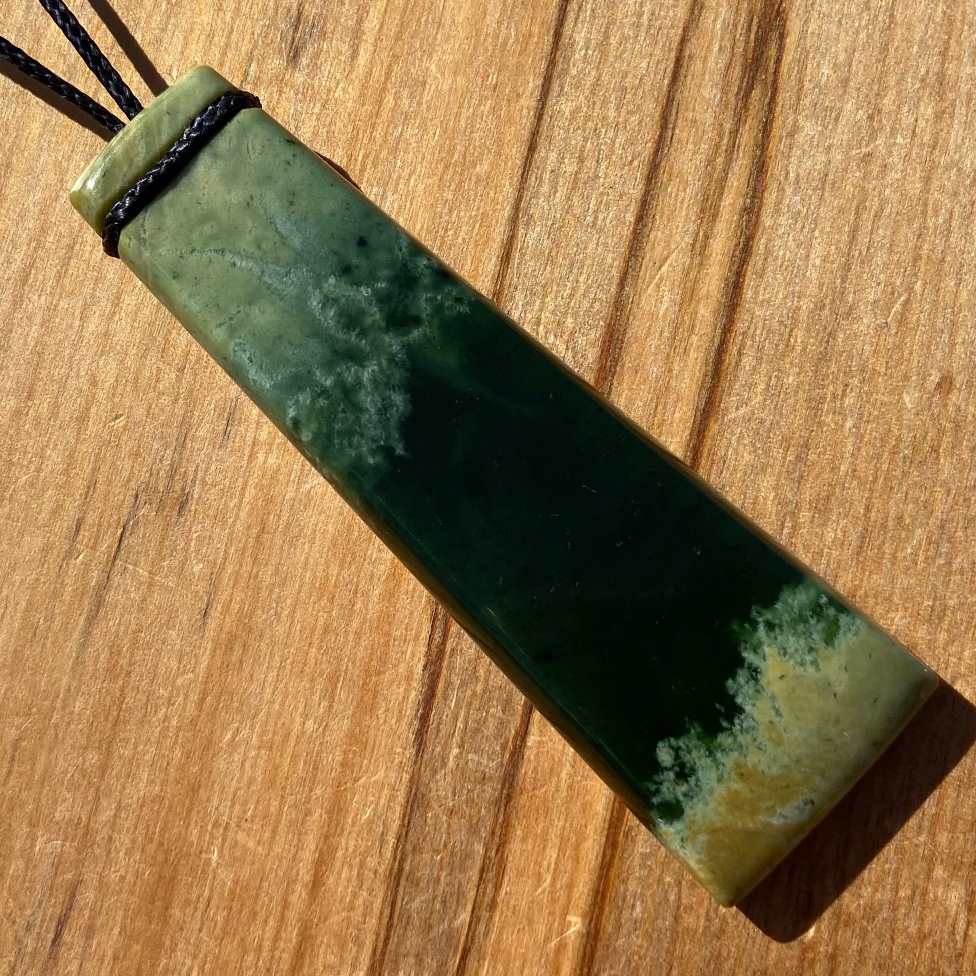 Pounamu toki pendant hand-carved from New Zealand Marsden Flower Jade pounamu (greenstone). Front