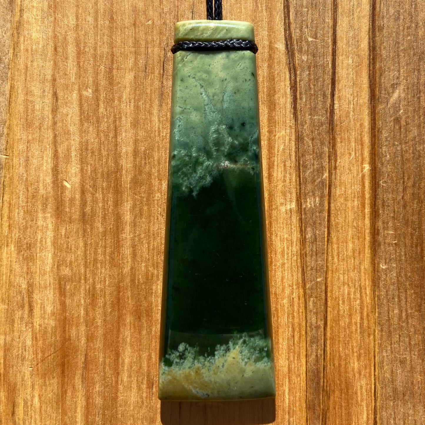 Pounamu toki pendant hand-carved from New Zealand Marsden Flower Jade pounamu (greenstone). Front